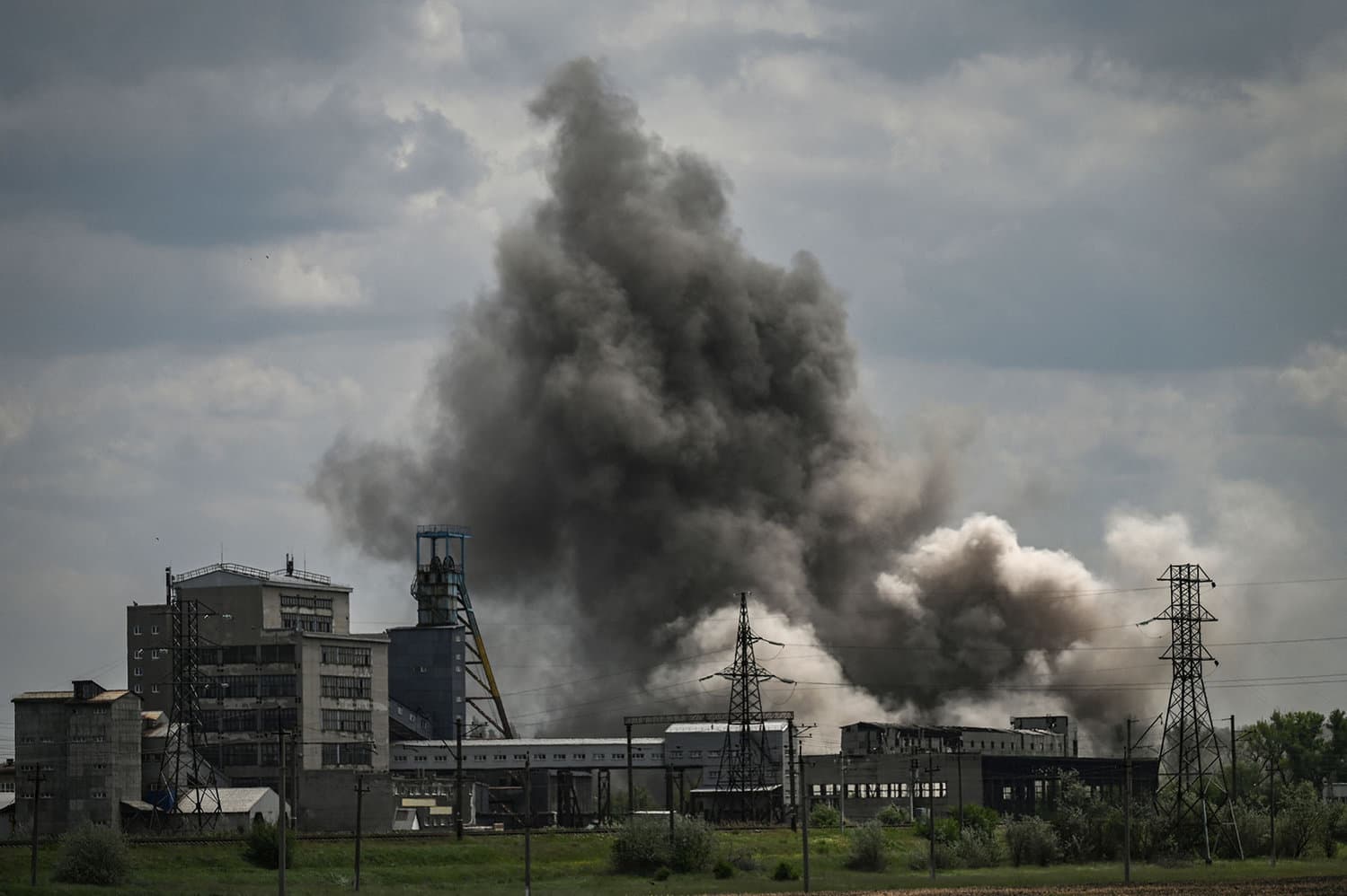 Smoke and dirt ascends after a strike at a factory in the city of Soledar