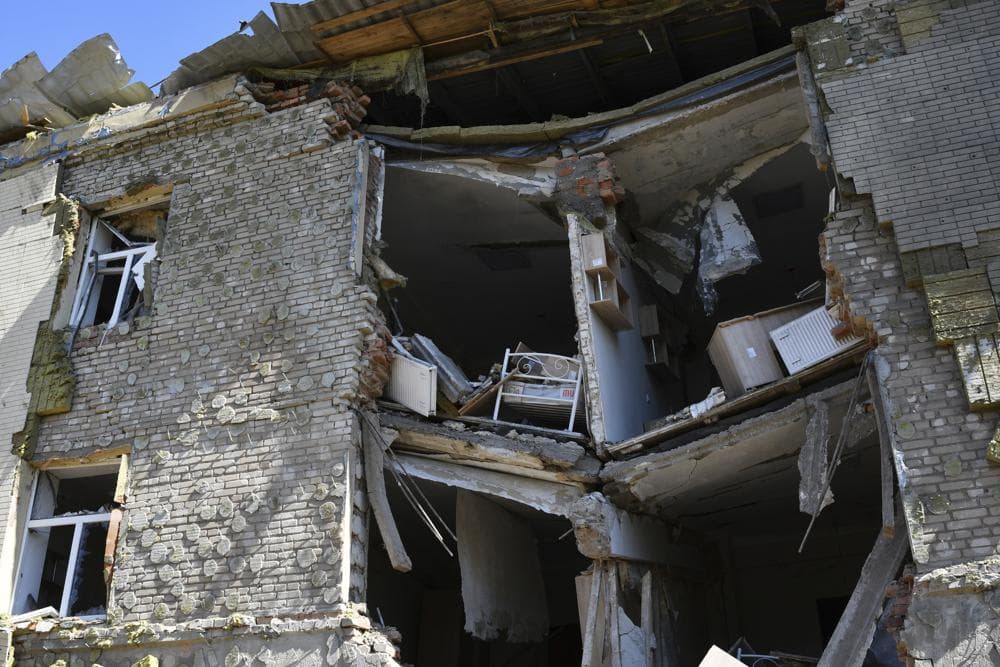 A baby bed is seen inside an apartment building damaged by Russian shelling in Bakhmut