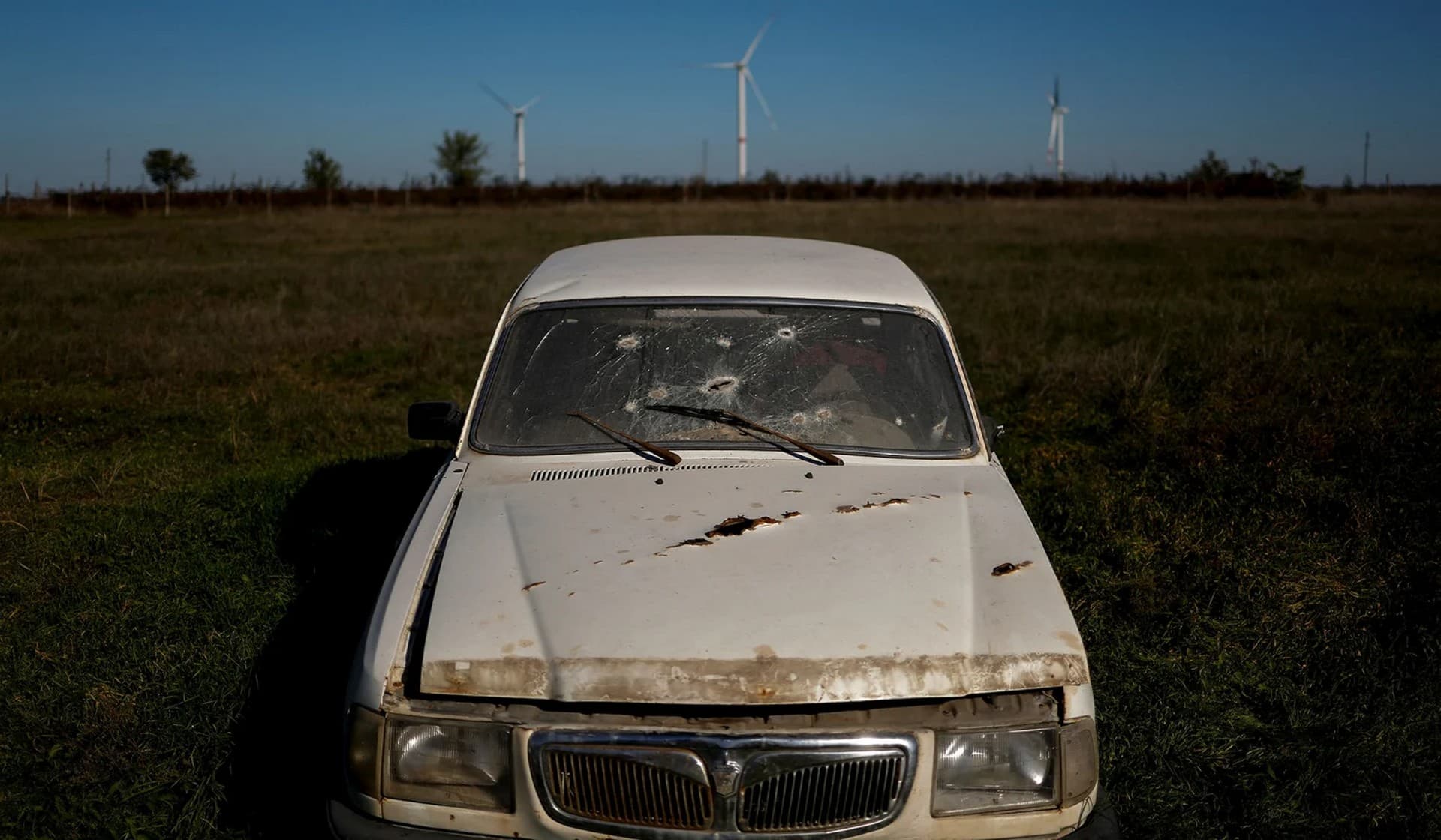 A car damaged by shrapnel during Russia's attack in the village of Lymany