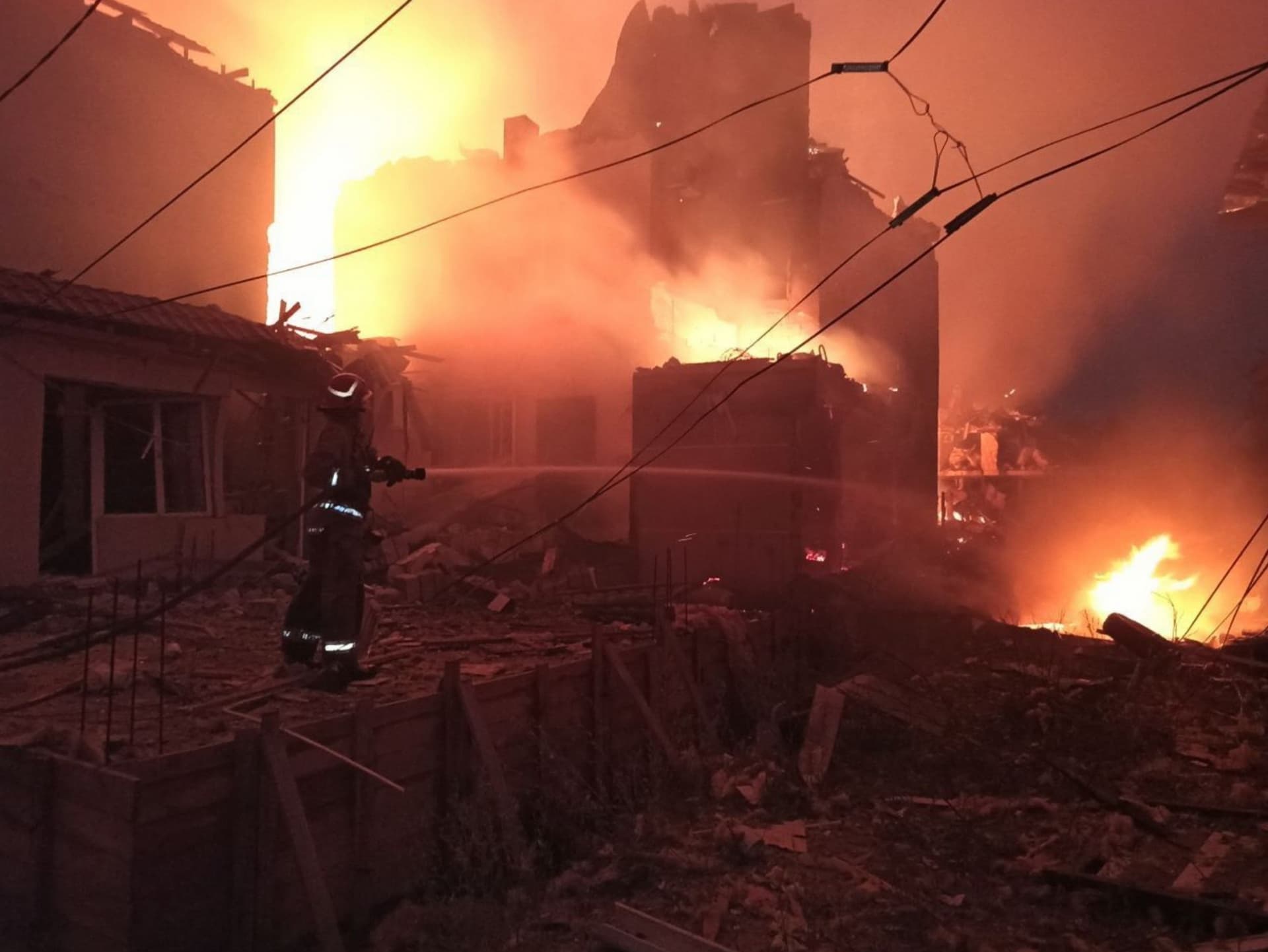 A firefighter works to contain the aftermath of a Russian attack in Zatoka