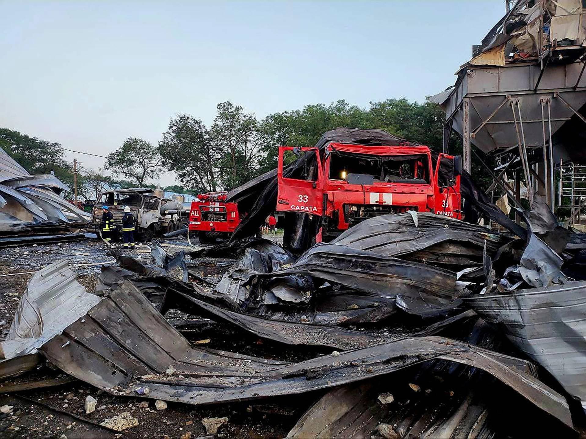 A heavily damaged emergency vehicle is seen at a compound of an agricultural company hit by a Russian missile strike in Odesa region