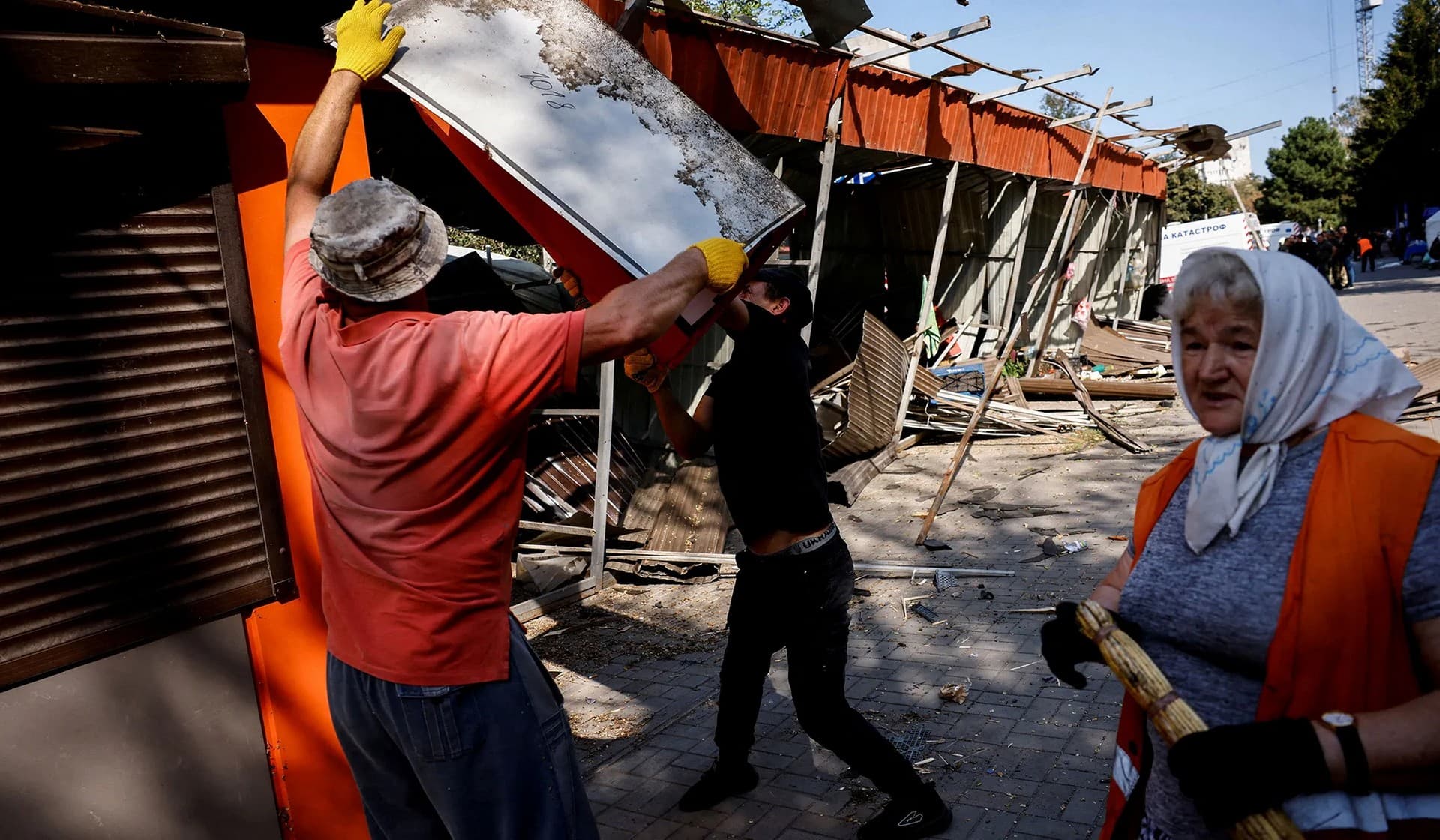 Municipality workers operate at the site of a heavily damaged hotel during a Russian missile strike in Cherkasy
