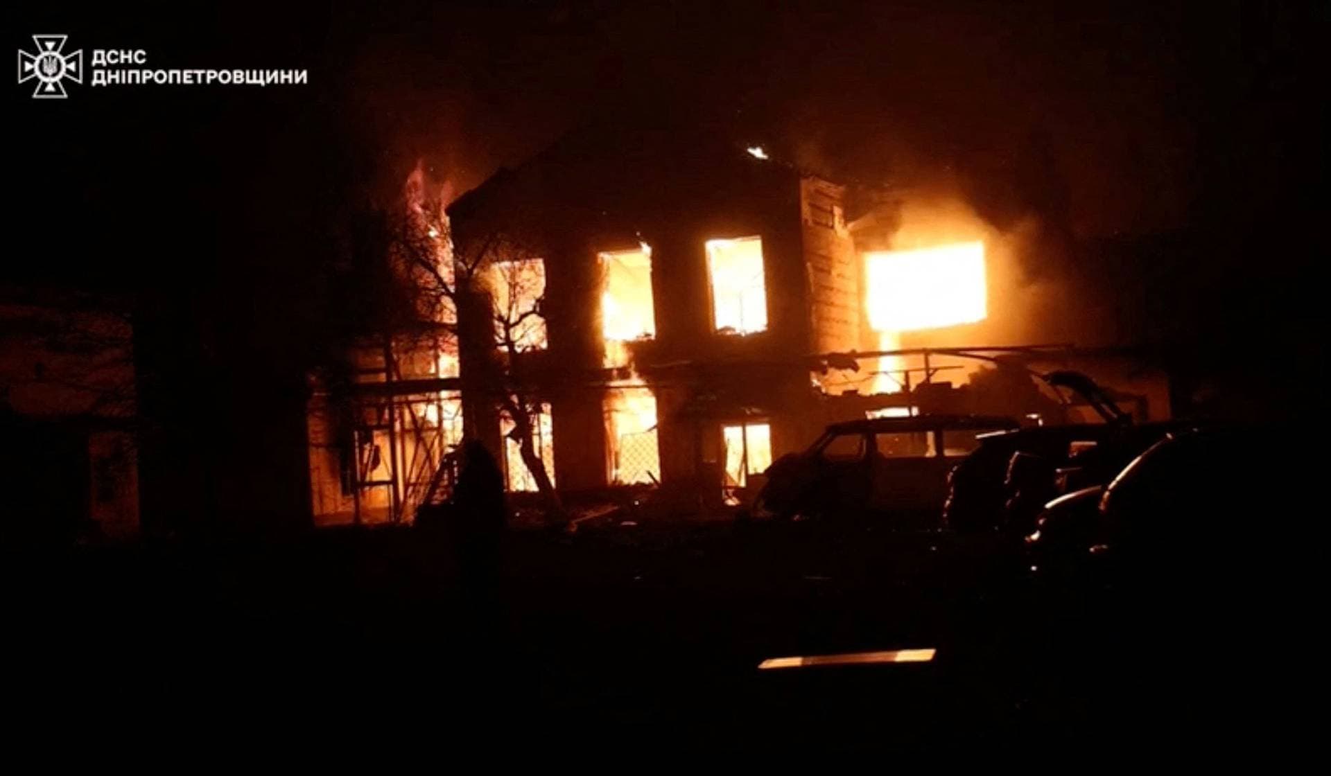 Smoke and flames rise from a building at the site of a Russian drone strike in a location given as Dnipropetrovsk Region