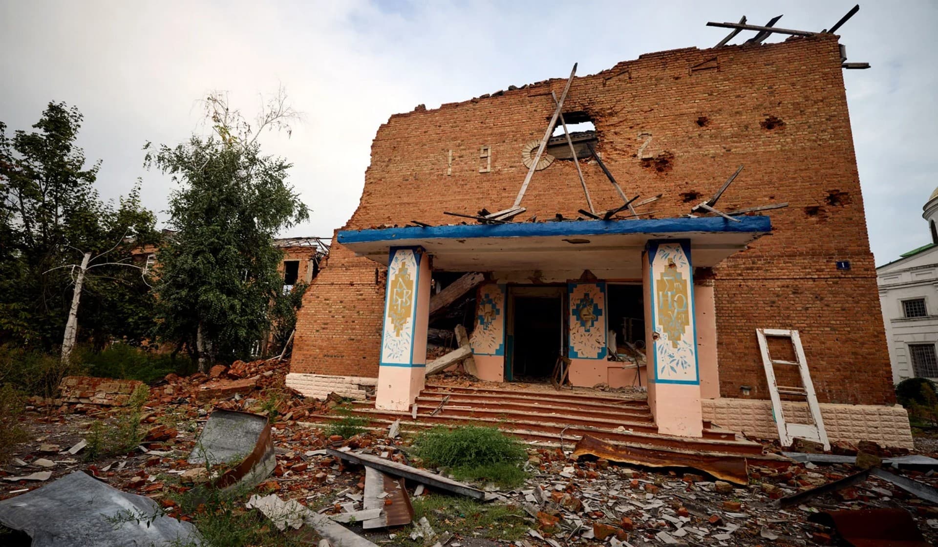 A building damaged by military strike in the town of Izium