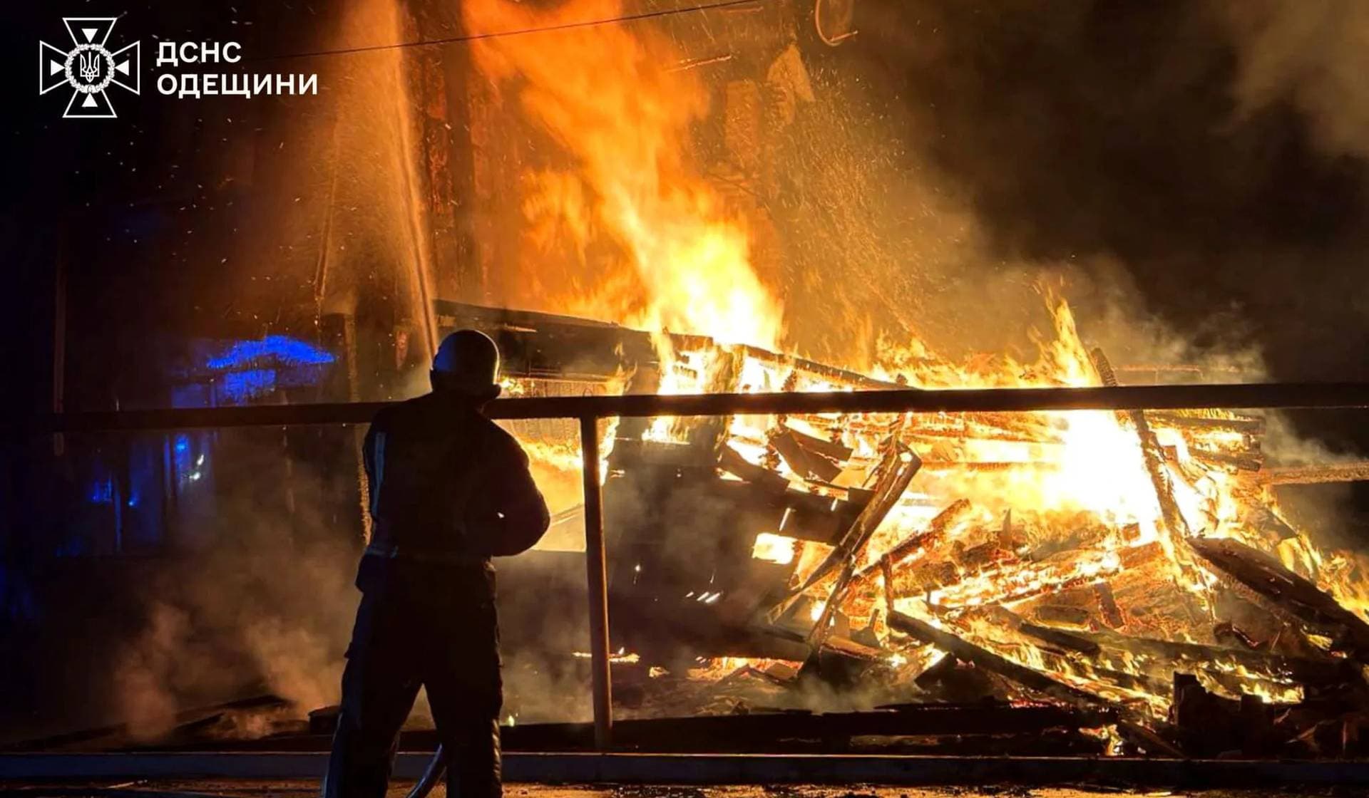 firefighter works at a site of a Russian drone strike in Izmail