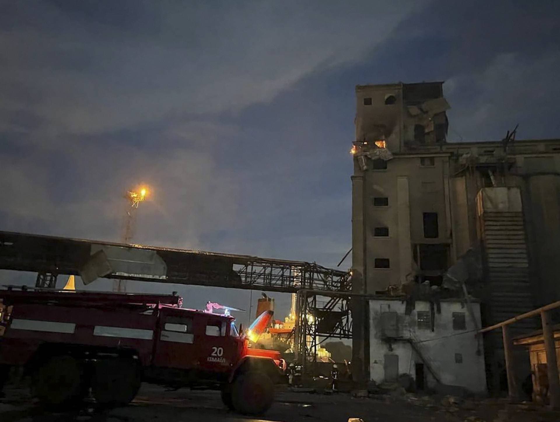 Rescuers work on a scene of drone attack in Odesa region