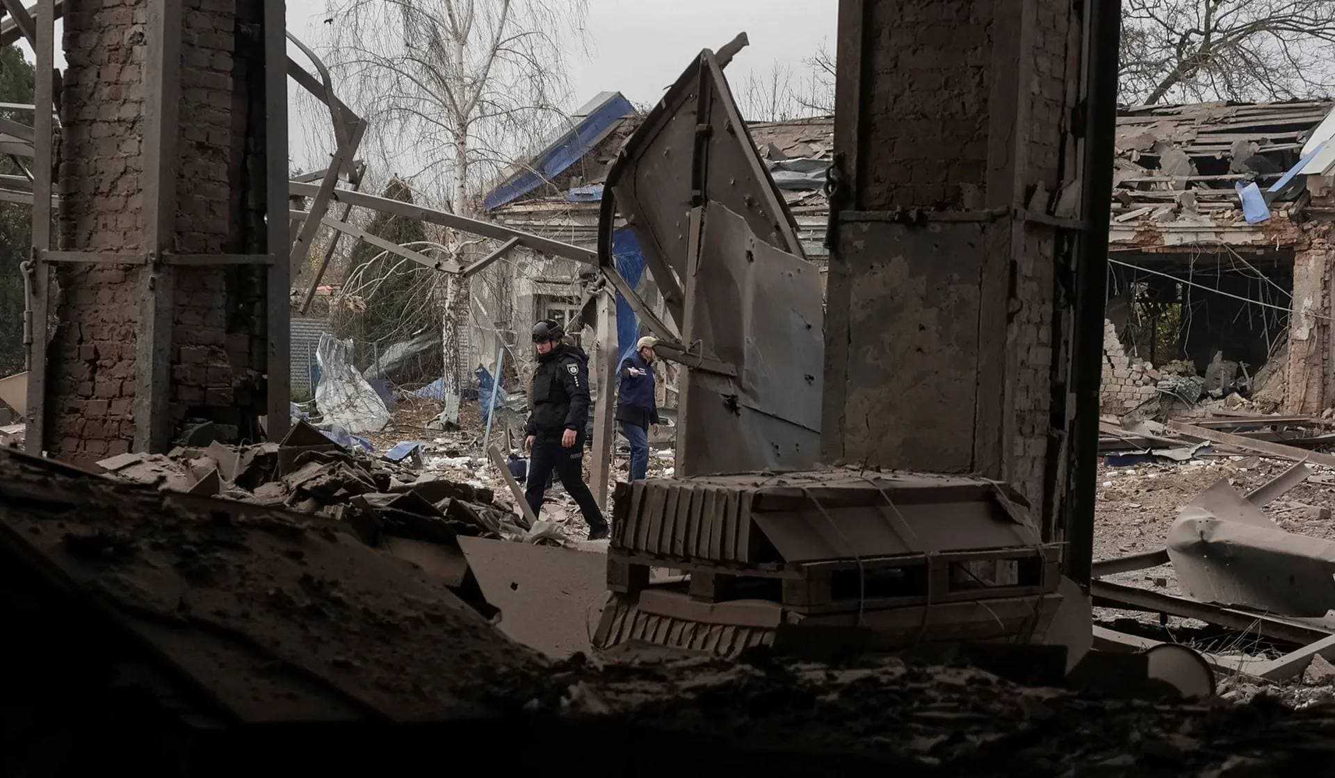 A police officer works at the site of the Russian air strike in Kharkiv, Ukraine, October 24, 2025. 