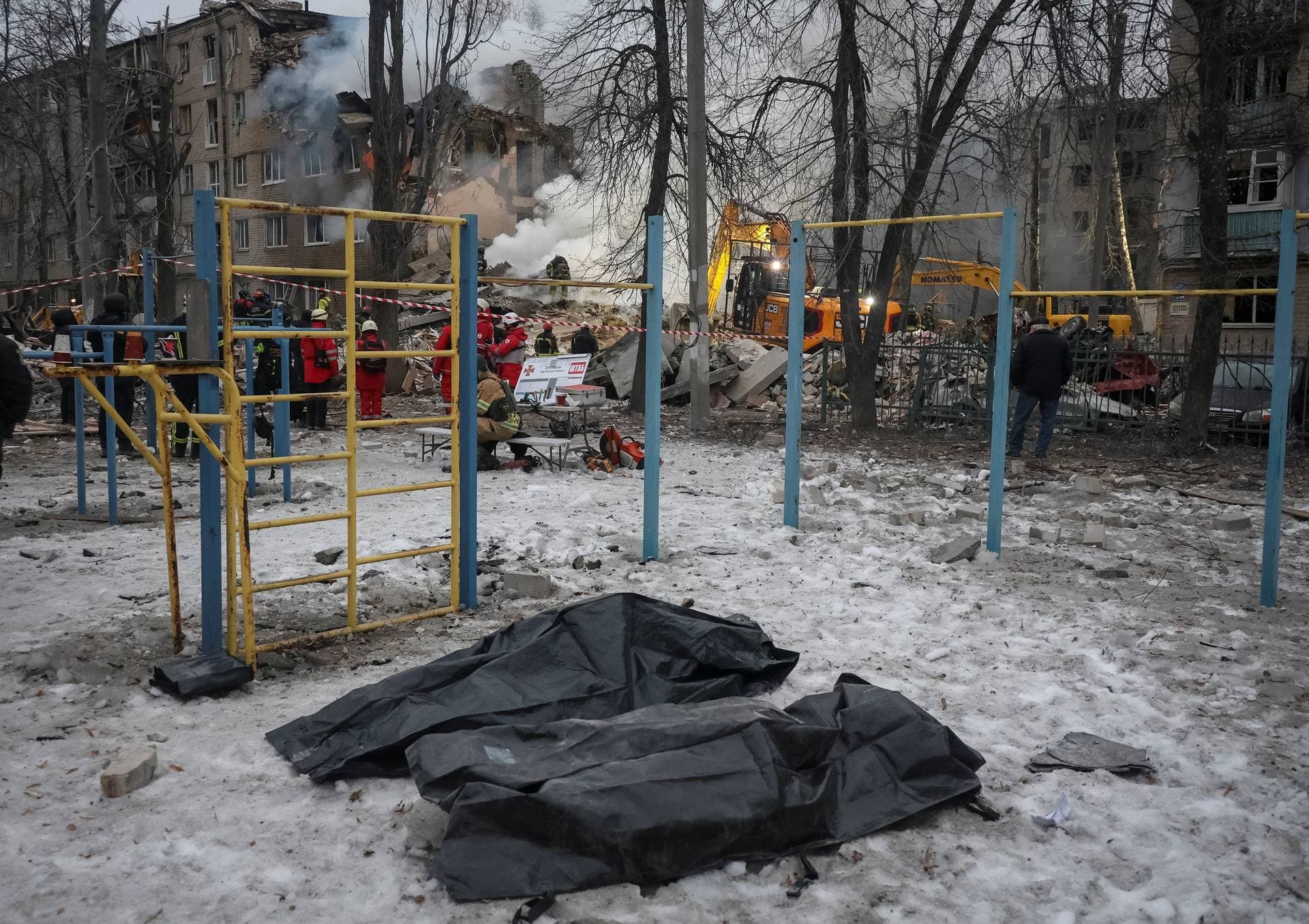 Bags with bodies of persons found under debris of an apartment building which was hit during overnight Russian missile strikes in Kharkiv
