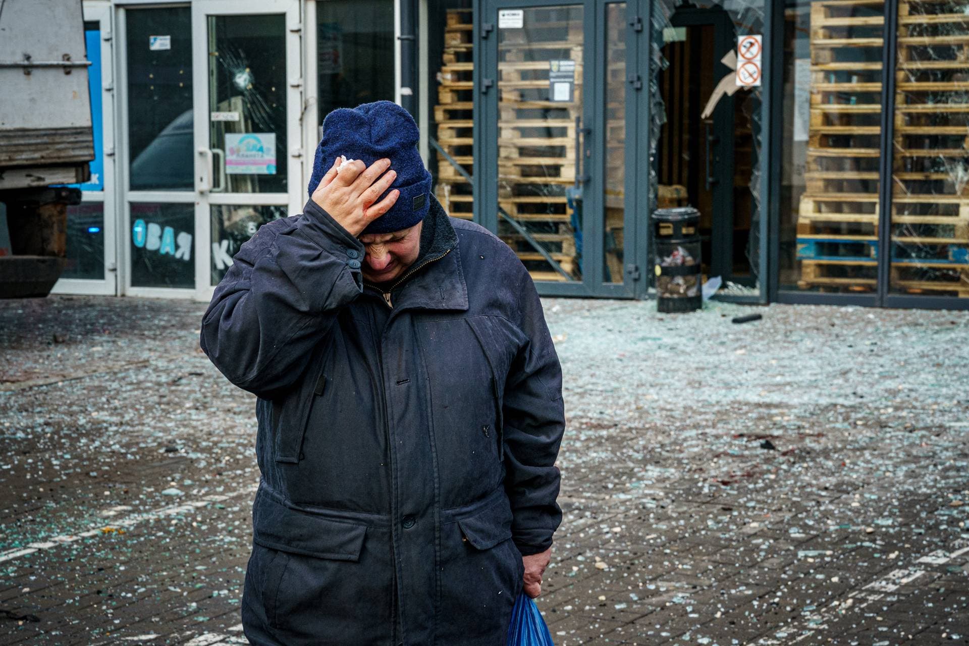 A woman reacts after Russian shelling to Ukrainian city of Kherson