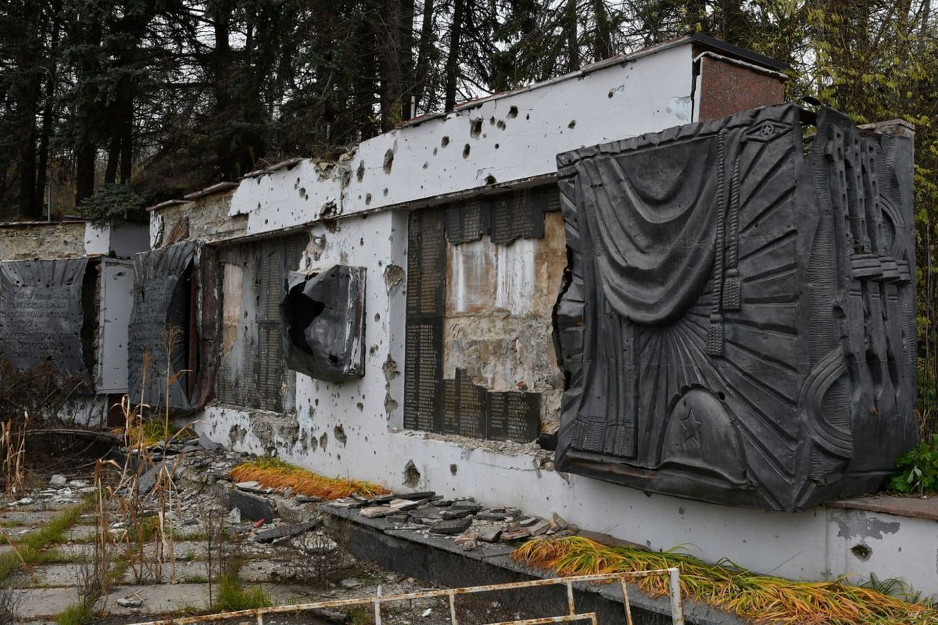 A view of a WWII memorial damaged by fighting in the village of Dolyna