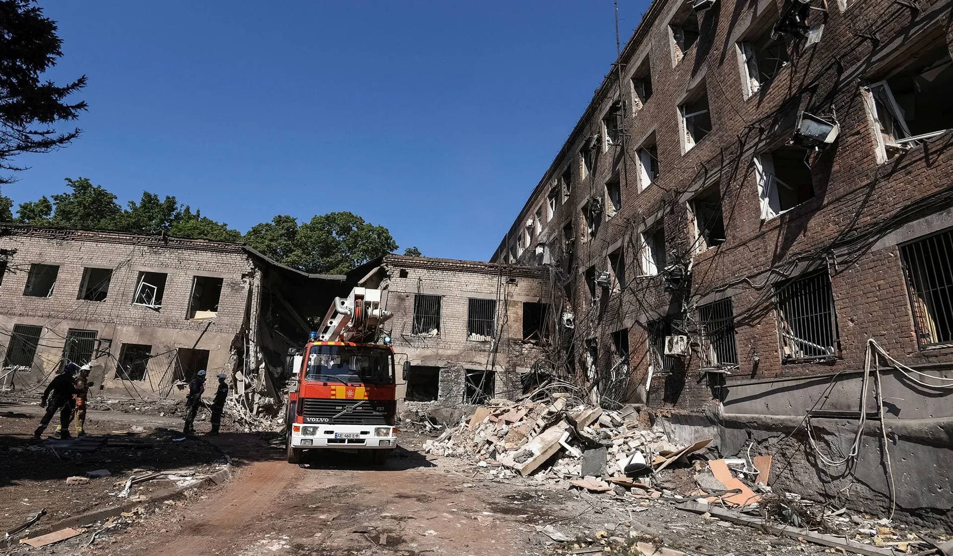 Rescuers work at an apartment building hit by a Russian missile strike in Kryvyi Rih