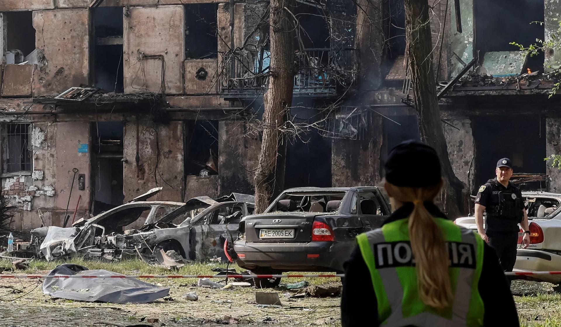 Rescuers work at a site of a residential building heavily damaged by a Russian missile strike in Kryvyi Rih