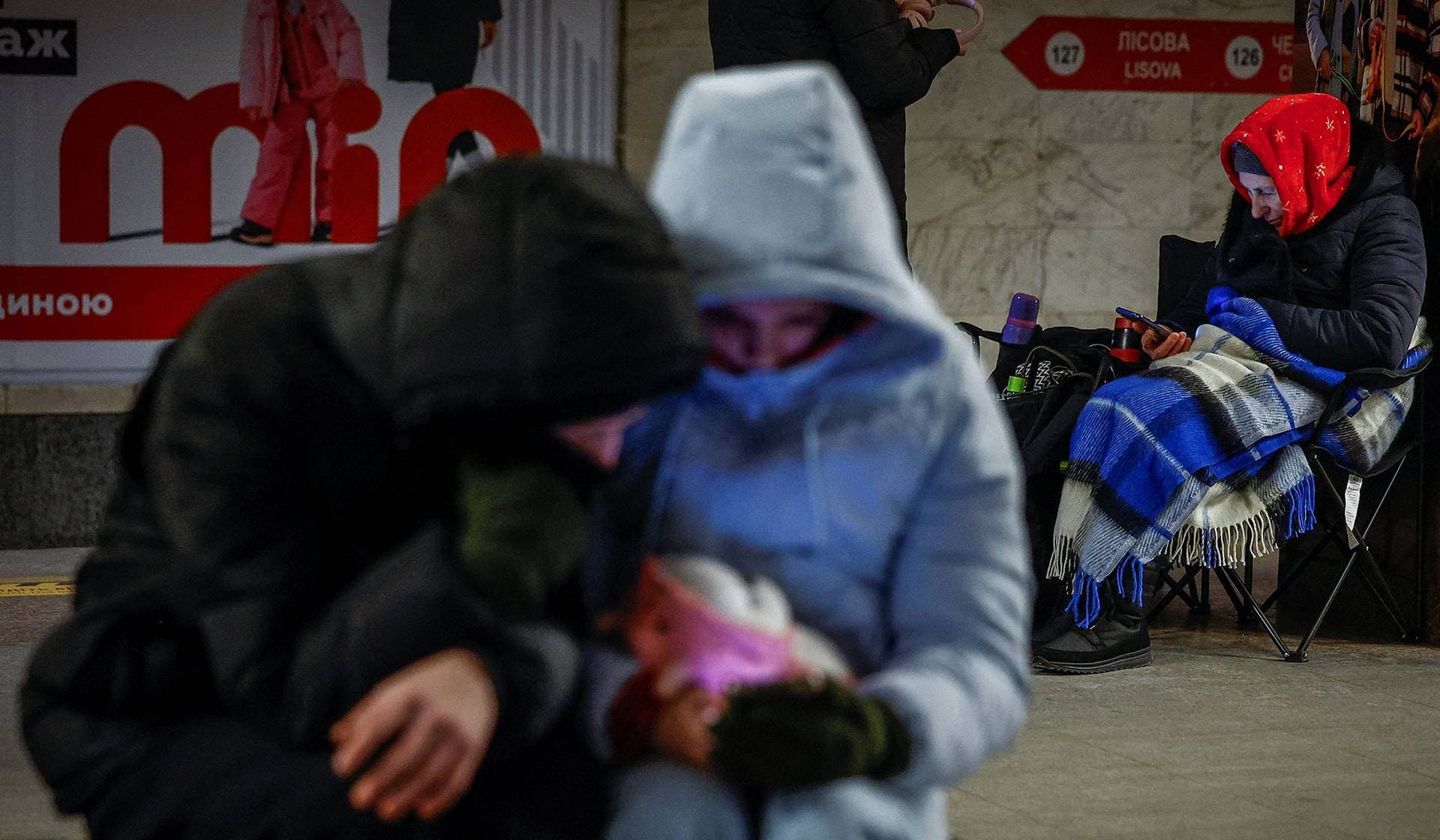 Residents take shelter inside a metro station during a Russian overnight missile and drone strike in Kyiv