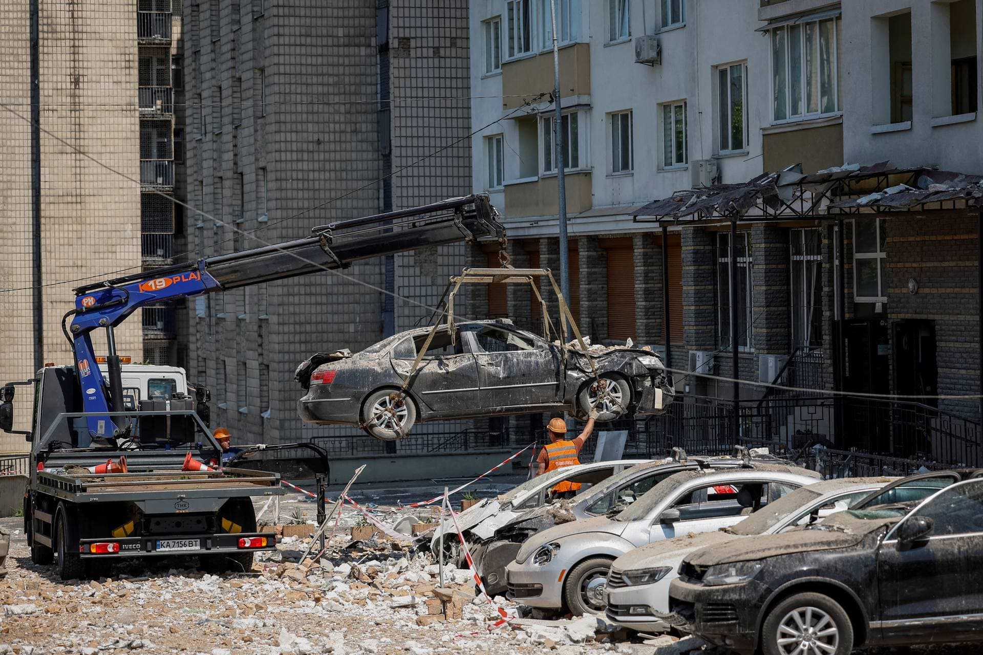 cars damaged during the latest Russian drone strike on Kyiv