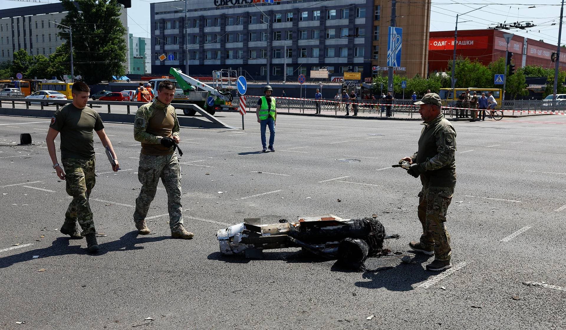 People working on their laptops while they take cover at metro station during a Russian rocket attack in Kyiv