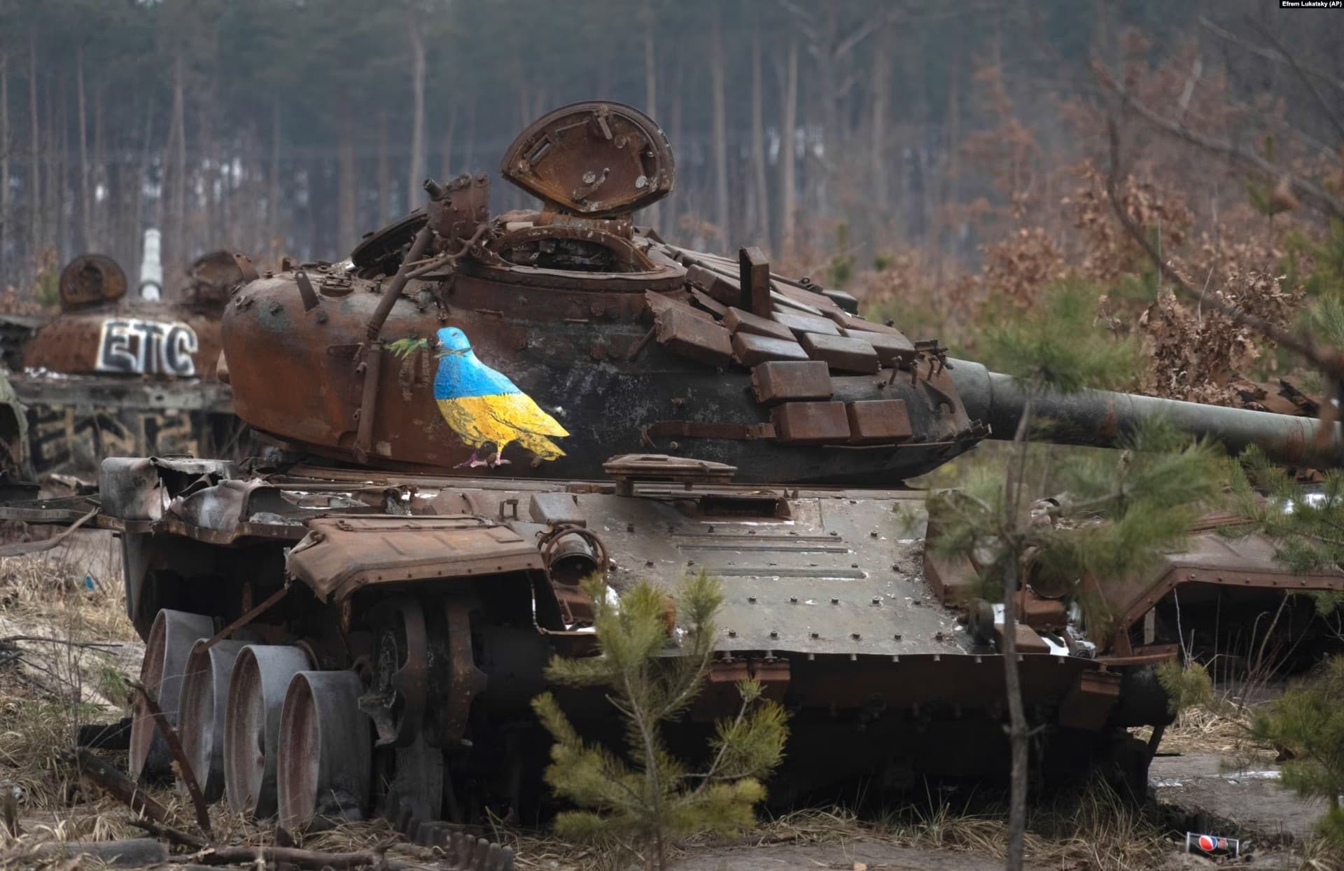a burned out Russian tank in the village of Dmytrivka