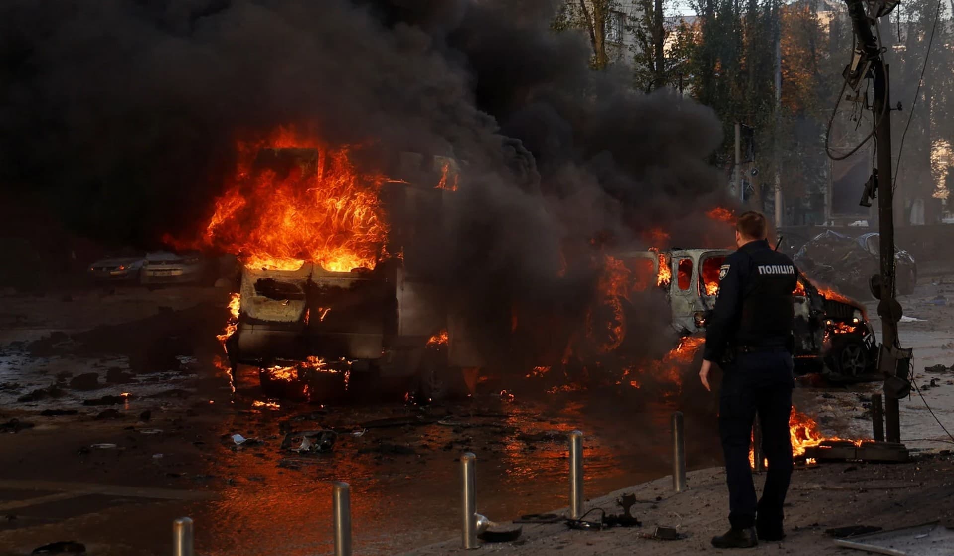 Cars on fire after a Russian missile attack in Kyiv