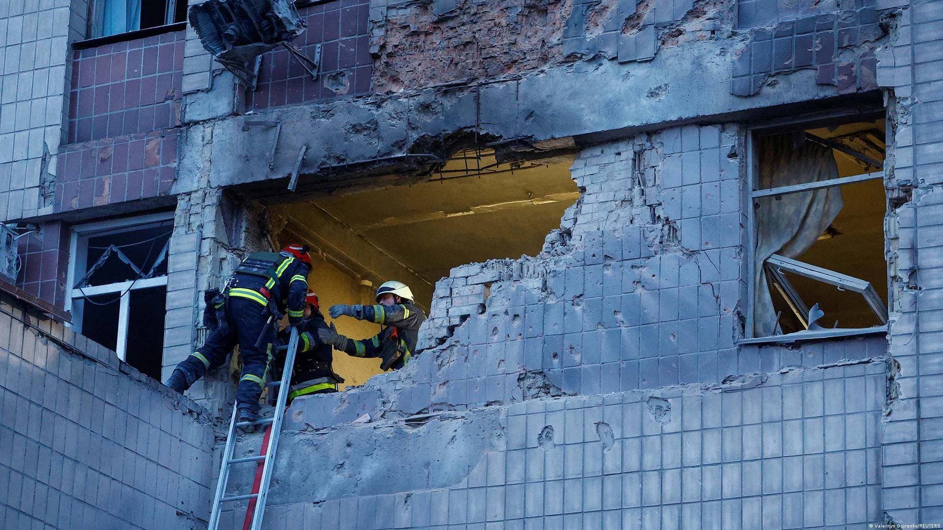 Rescuers work at the site of a building damaged during a Russian suicide drone strike in Kyiv