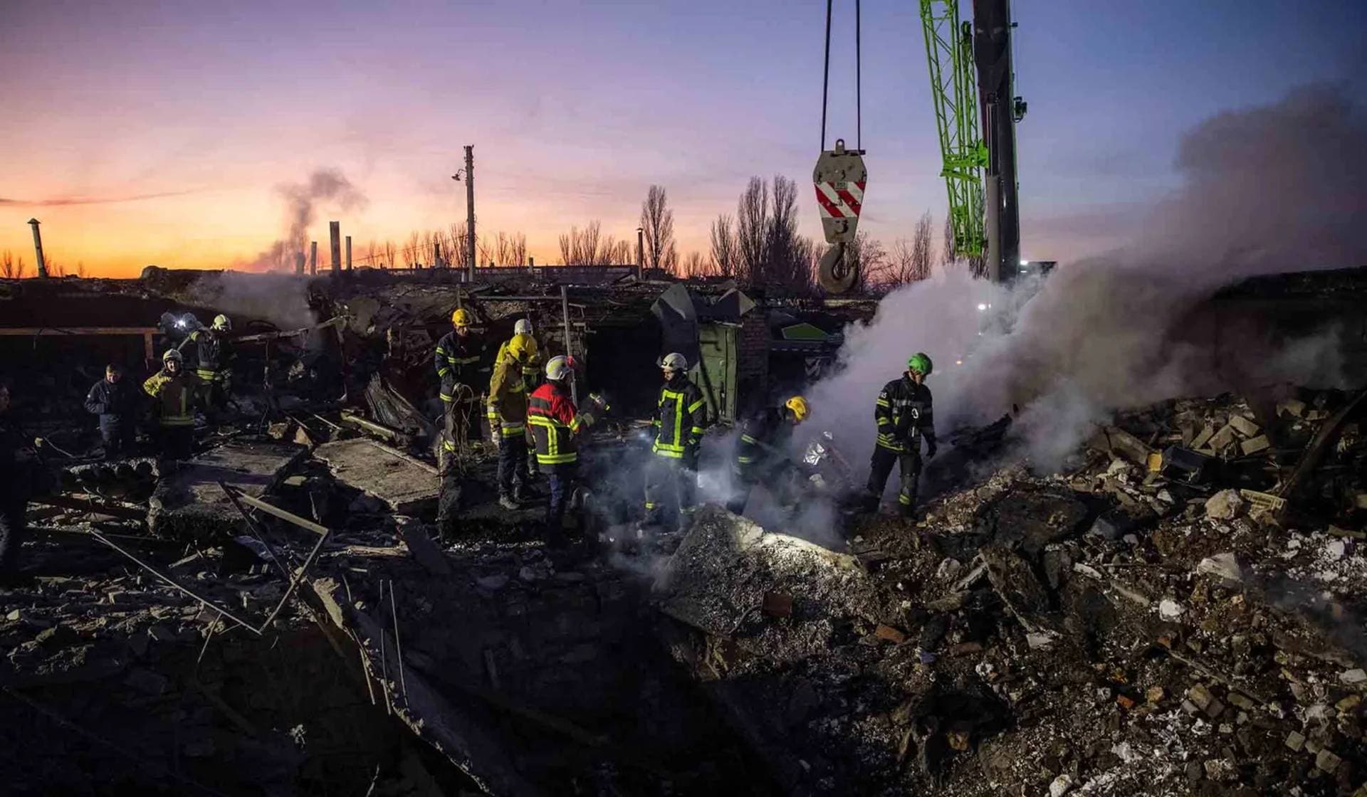 Rescuers work at an area heavily damaged by a Russian missile strike in Mykolaiv