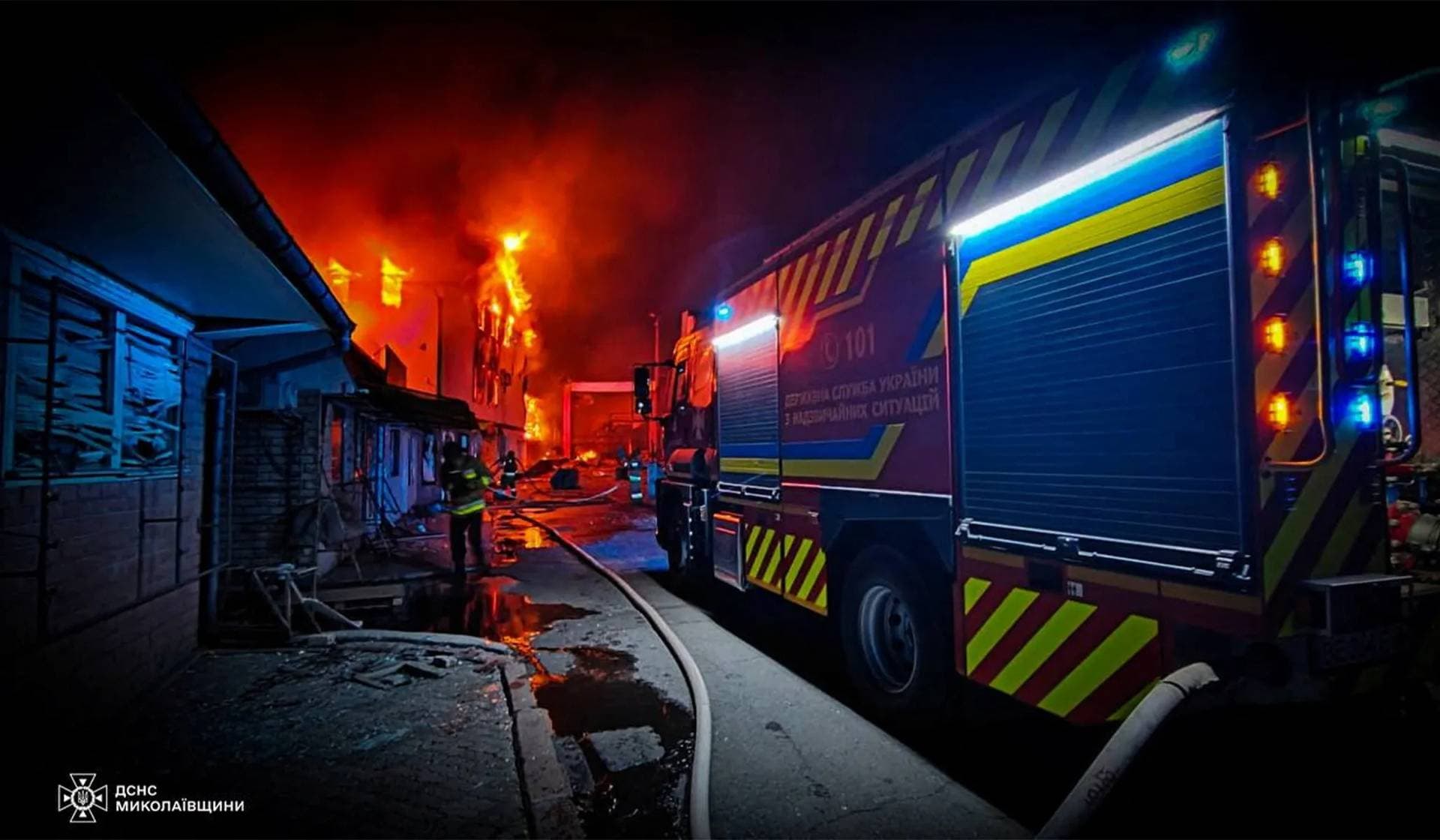 Rescuers work at the site of a Russian missile strike in Mykolaiv