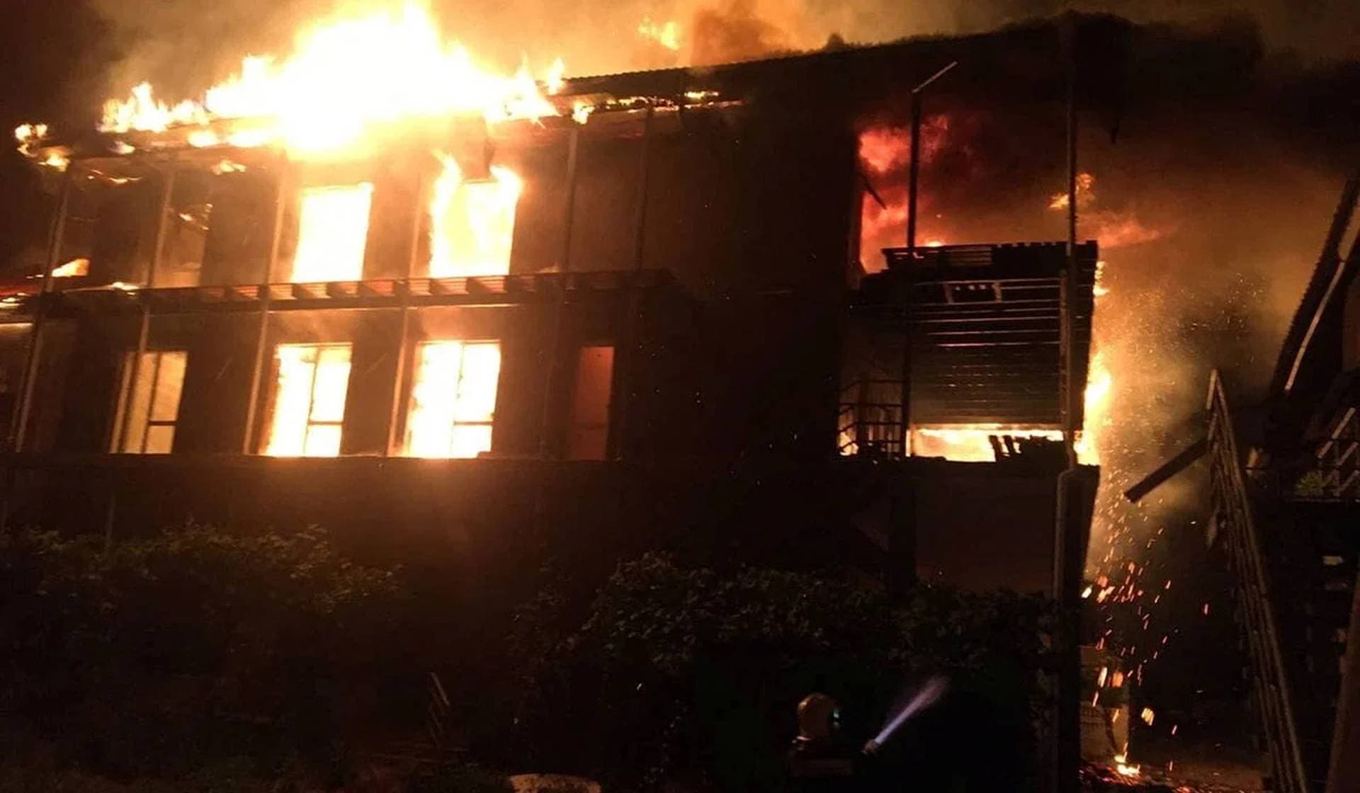 A firefighter works at the site of a recreation hotel hit by a Russian missile strike in the village of Kobleve