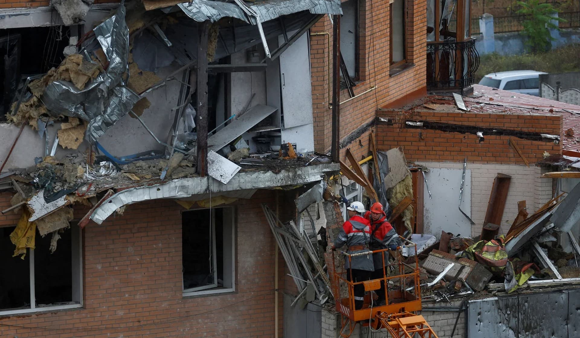 Rescuers work at a site of a residential building heavily damaged by a Russian missile attack in Mykolaiv