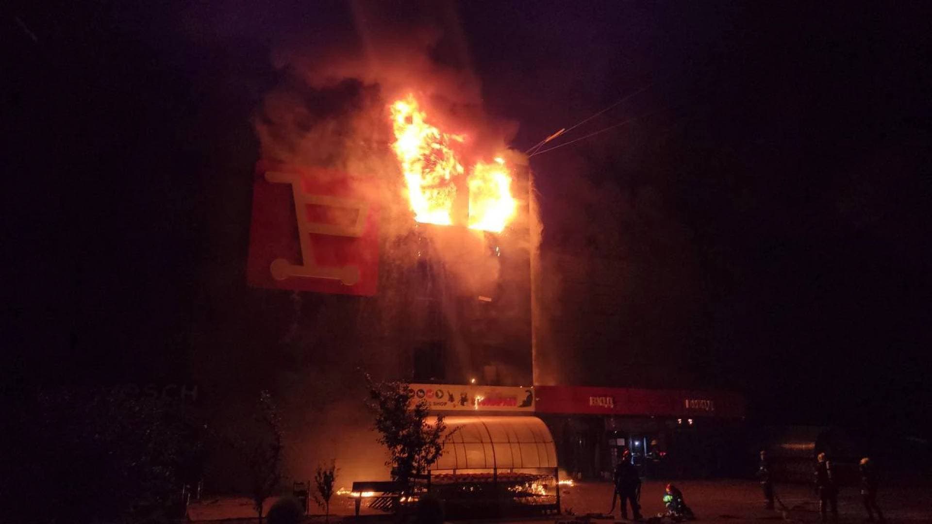 Firefighters work to put out a fire in a supermarket, during a Russian drone and missile strike amid Russia's attack in Odesa