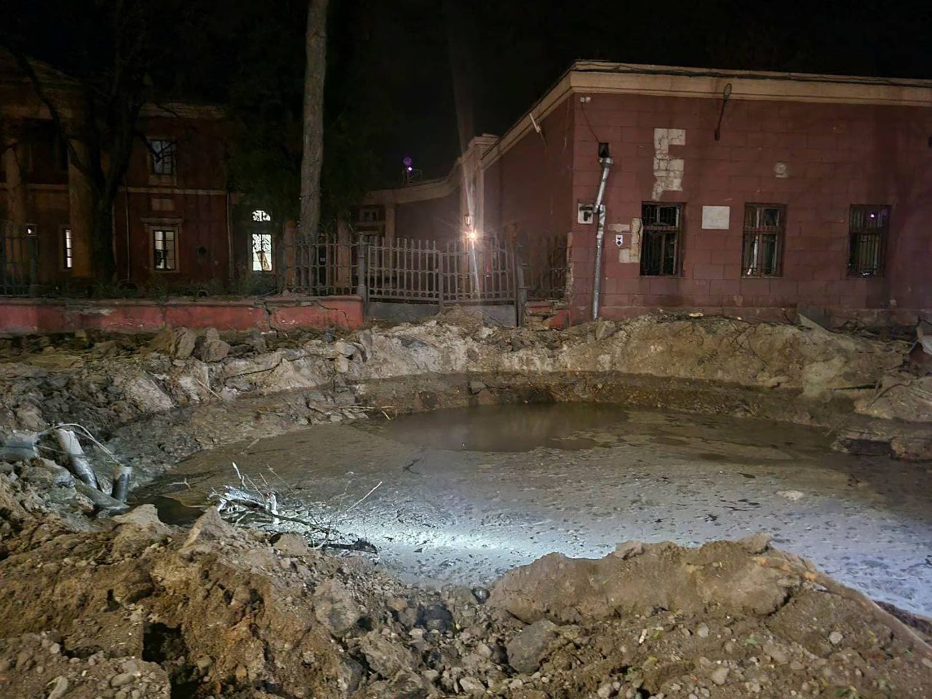 a crater left by a Russian rocket attack is seen in central Odesa
