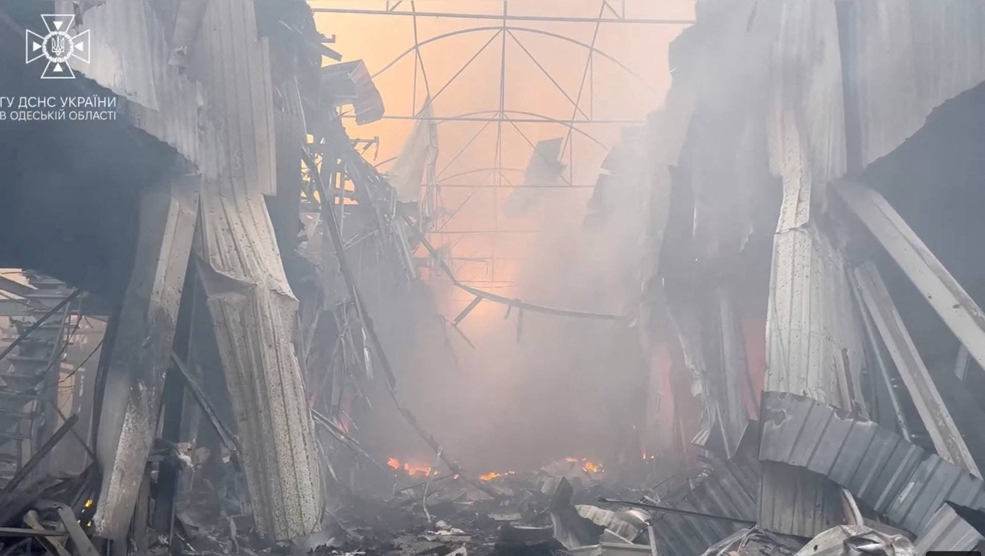 Smoke billows at a storage facilities site hit during Russian missile and drone strikes in Odesa