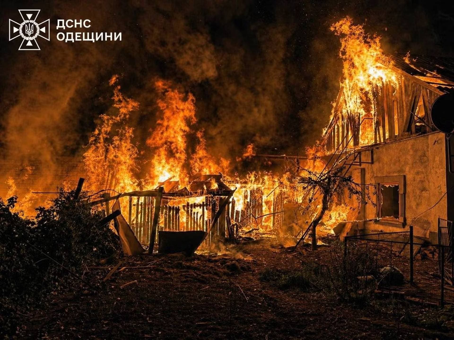 Firefighters work at a site of a Russian drone strike in Odesa Region