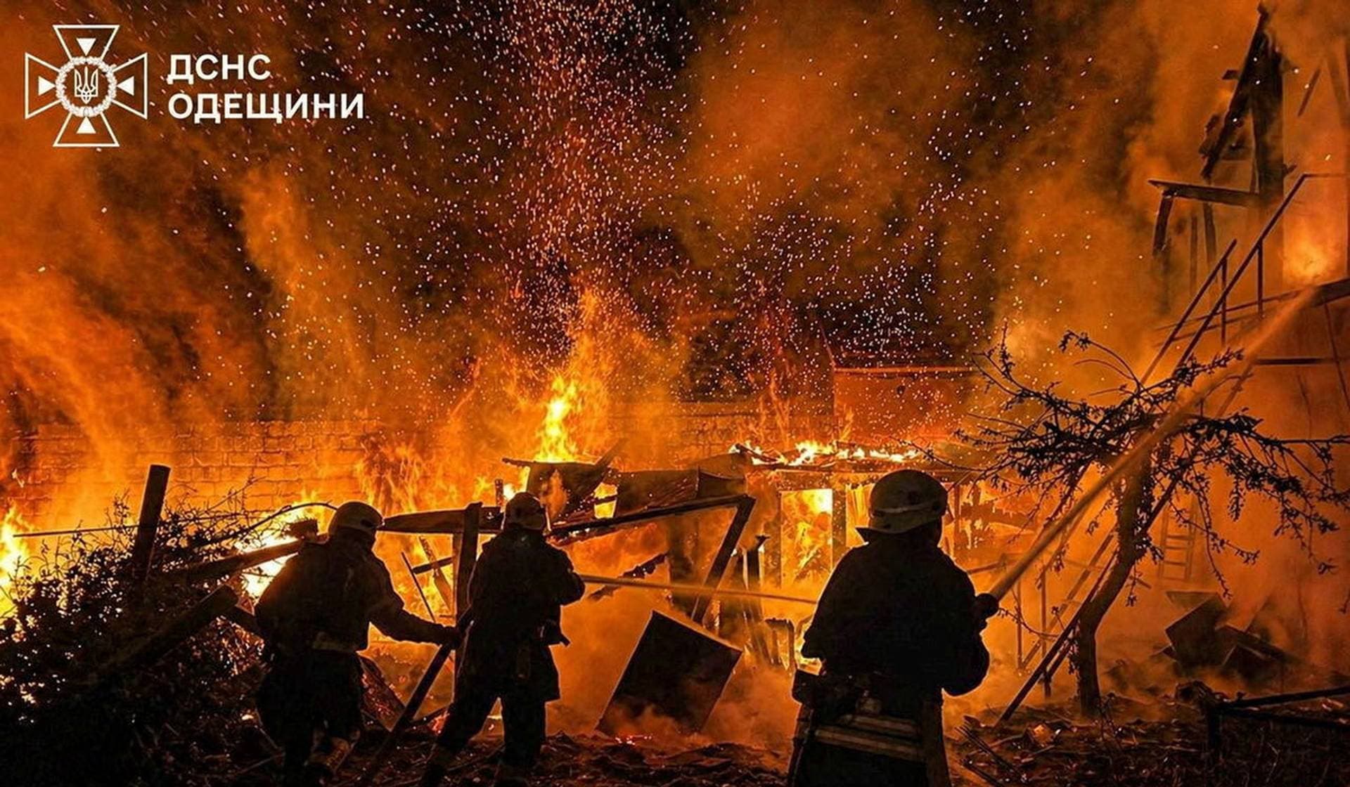 Firefighters work at a site of a Russian drone strike in Odesa Region