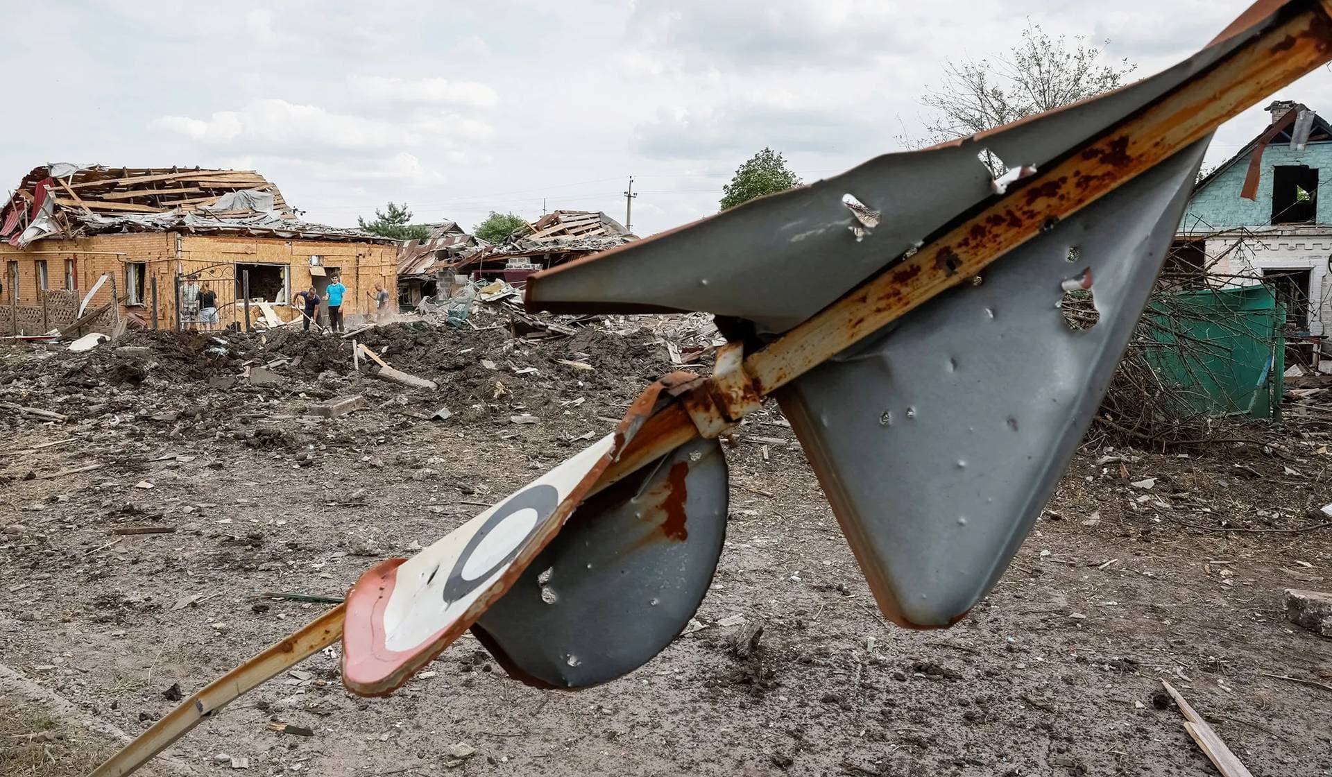 Rescuers work at the site where a building destroyed during a Russian missile strike in Pokrovsk