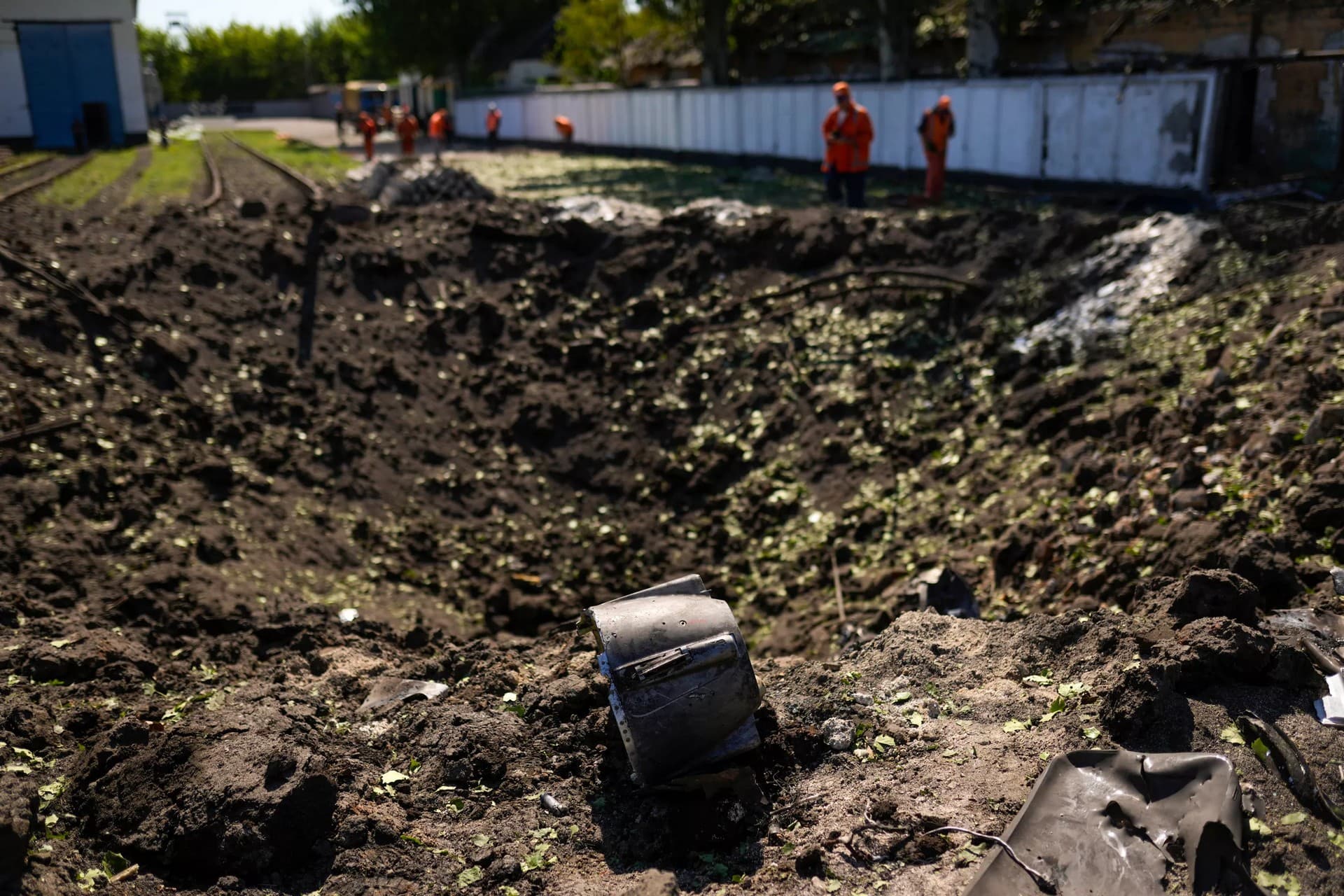 A piece of a rocket lies next a crater after a Russian strike in Pokrovsk