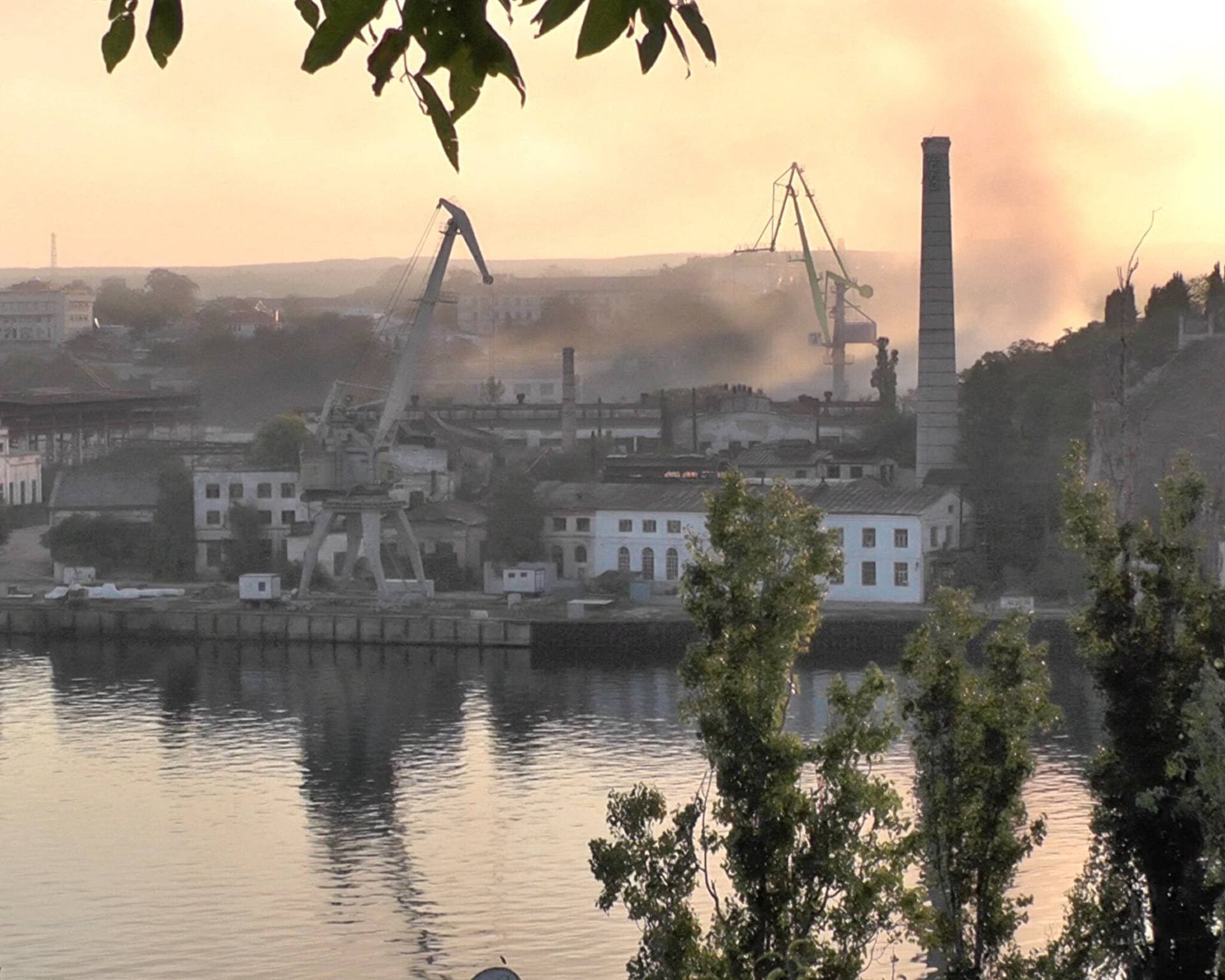 Smoke rises from the shipyard that was reportedly hit by Ukrainian missile attack in Sevastopol