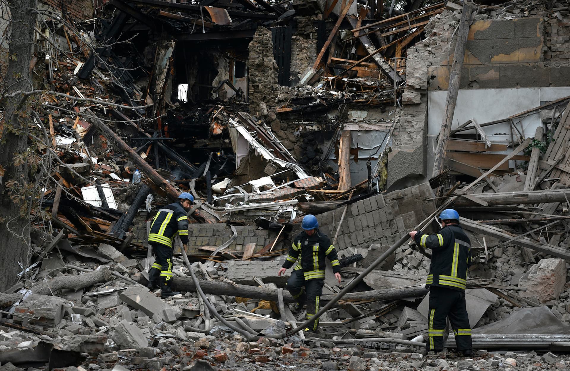 A firefighter works after a Russian attack that heavily damaged a building in Sloviansk
