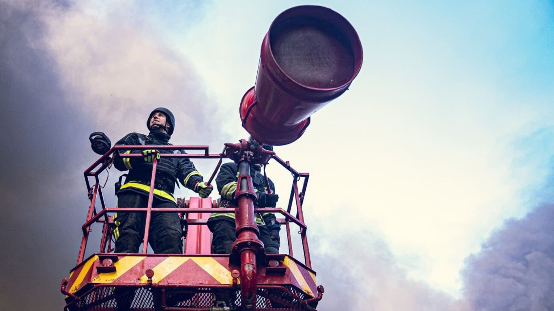 Firefighters work at the site of a Russian missile strike in a location given as Sumy