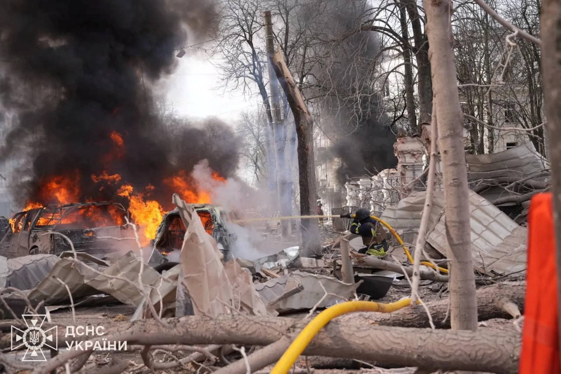 Firefighters work at the site of a Russian missile strike in central Sumy
