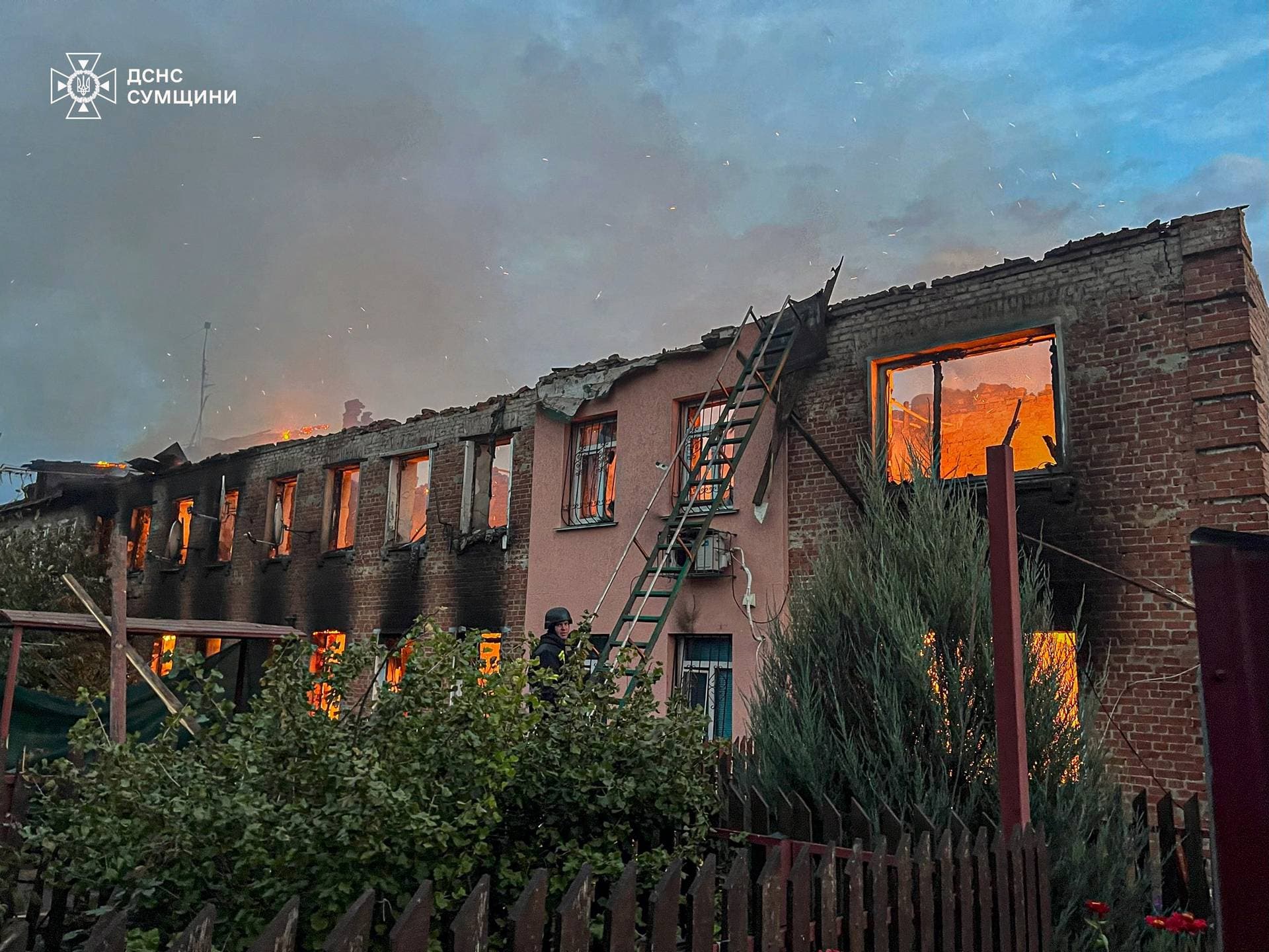 A firefighter works at the site of a Russian drone strike in Sumy Region