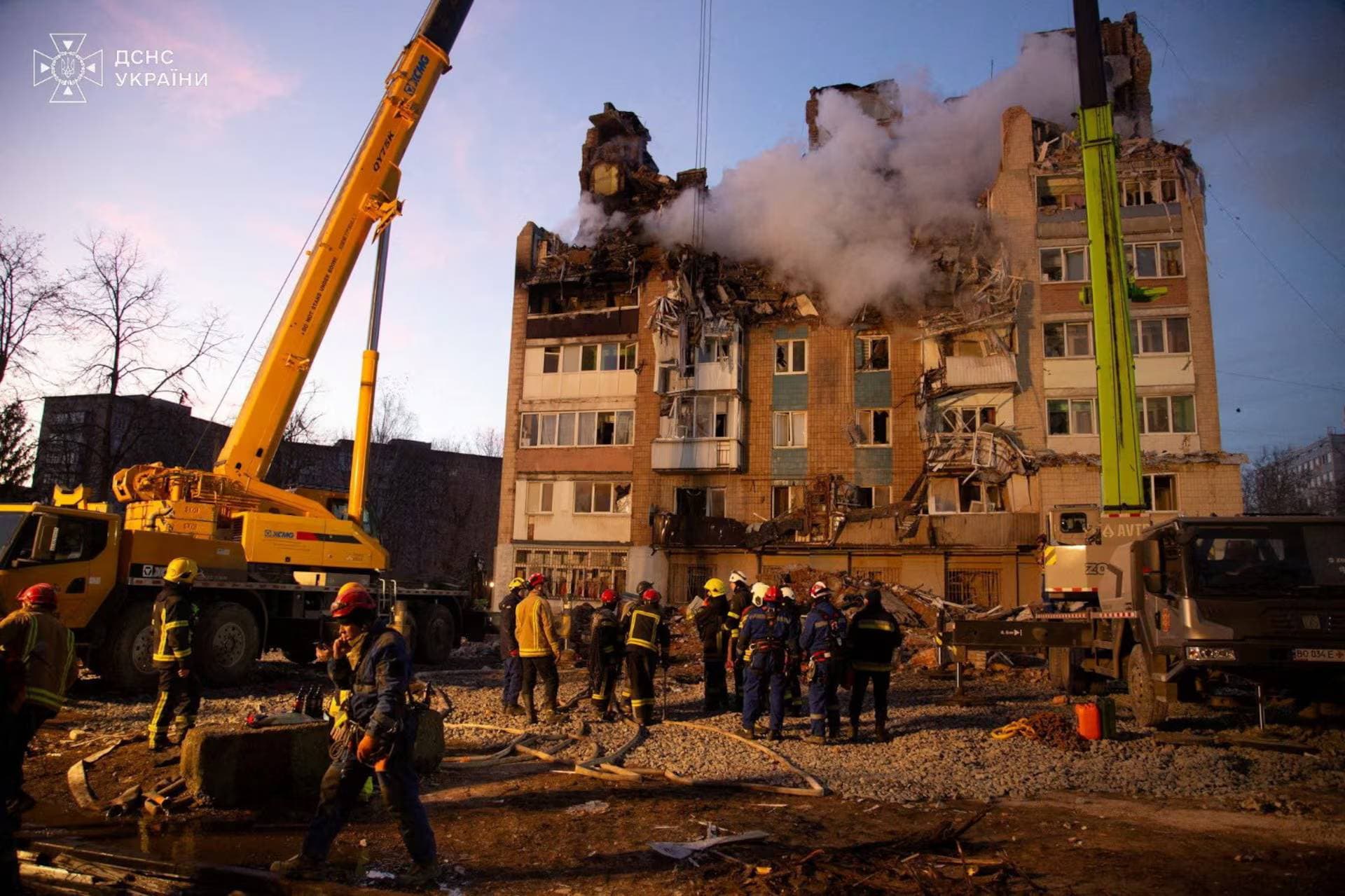 Rescuers work at the site of the apartment building hit by a morning Russian missile strike in Ternopil