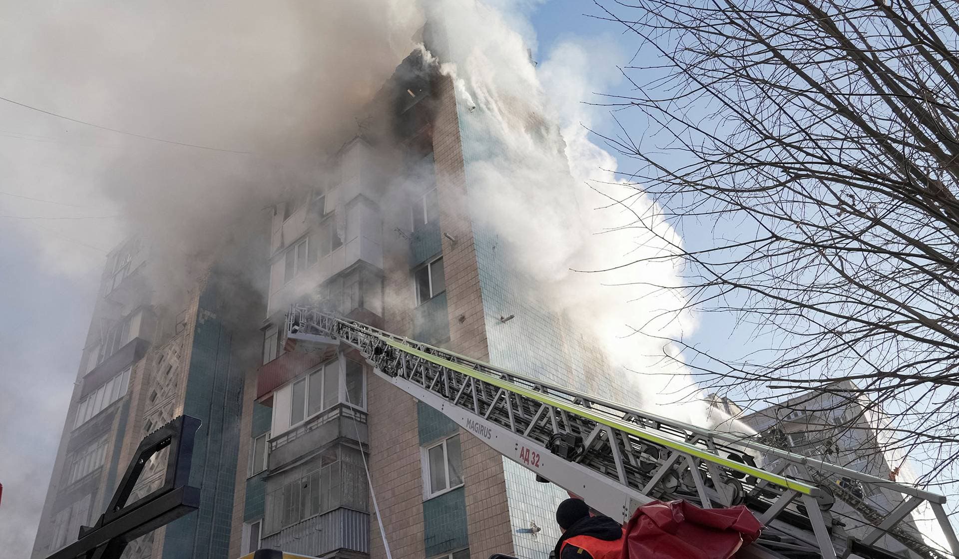 Rescuers work at the site of the apartment building hit by a morning Russian missile strike in Ternopil