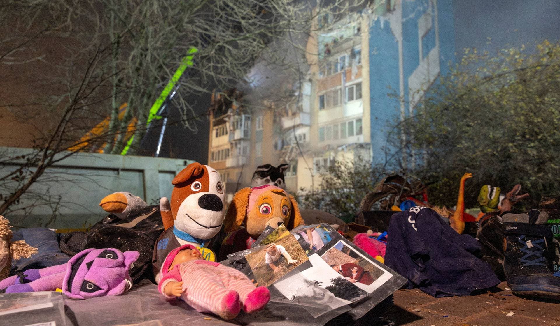 Soft toys lie at the site of an apartment building that was hit yesterday by a Russian missile in Ternopil