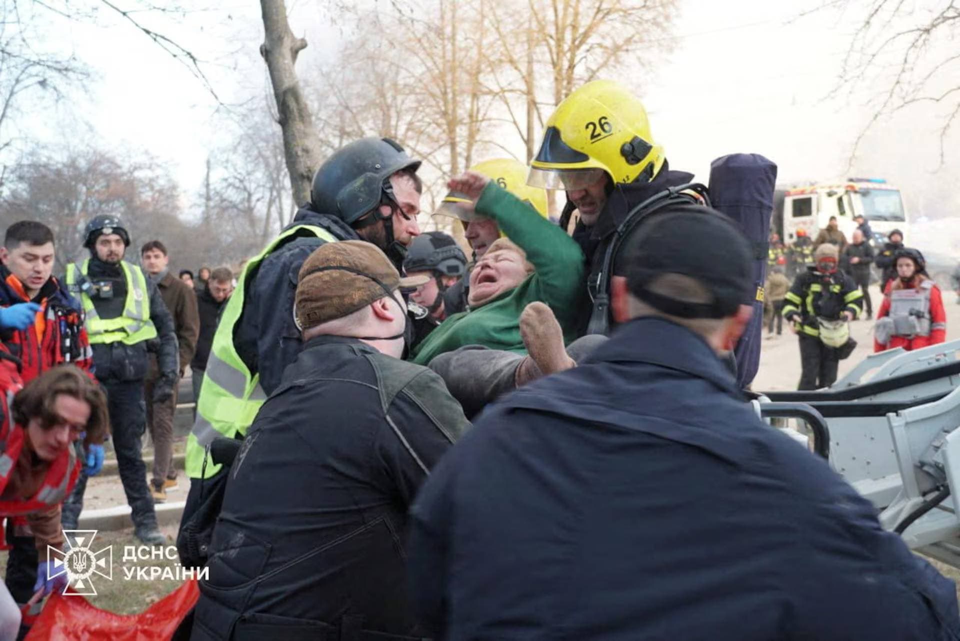 Rescuers evacuate a wounded person from the apartment building hit by a morning Russian missile strike in Ternopil