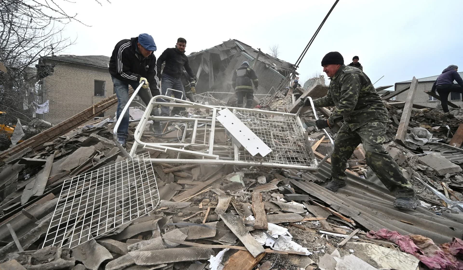 Rescuers work at the site of a maternity ward of a hospital destroyed by a Russian missile attack in Vilniansk