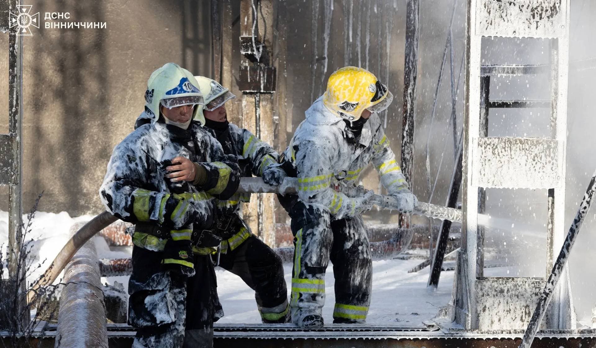 Firefighters work at the site of a critical infrastructure facility hit by a Russian missile strike in Vinnytsia Region