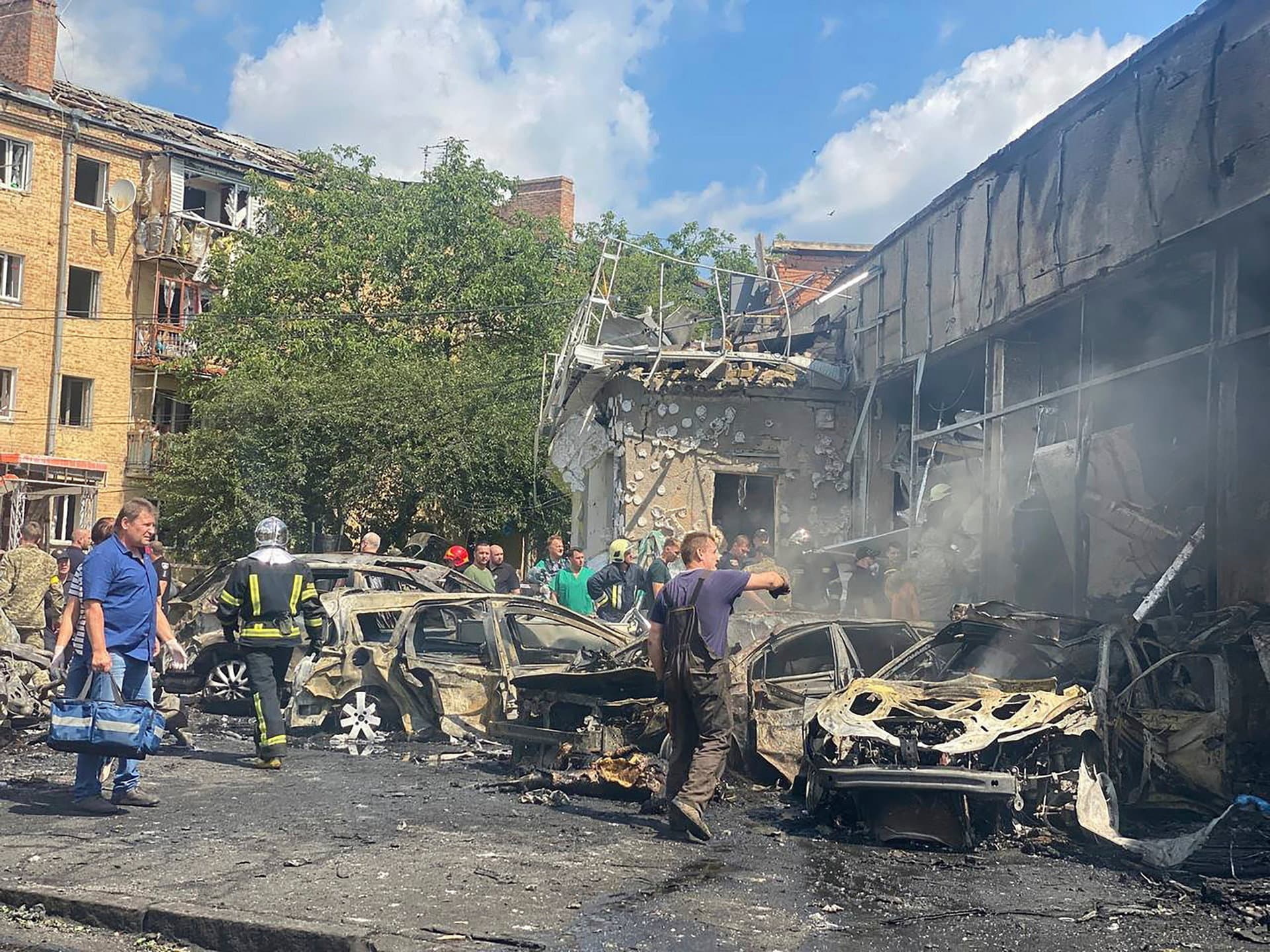 rescuers work on a scene of building damaged by shelling, in Vinnytsia