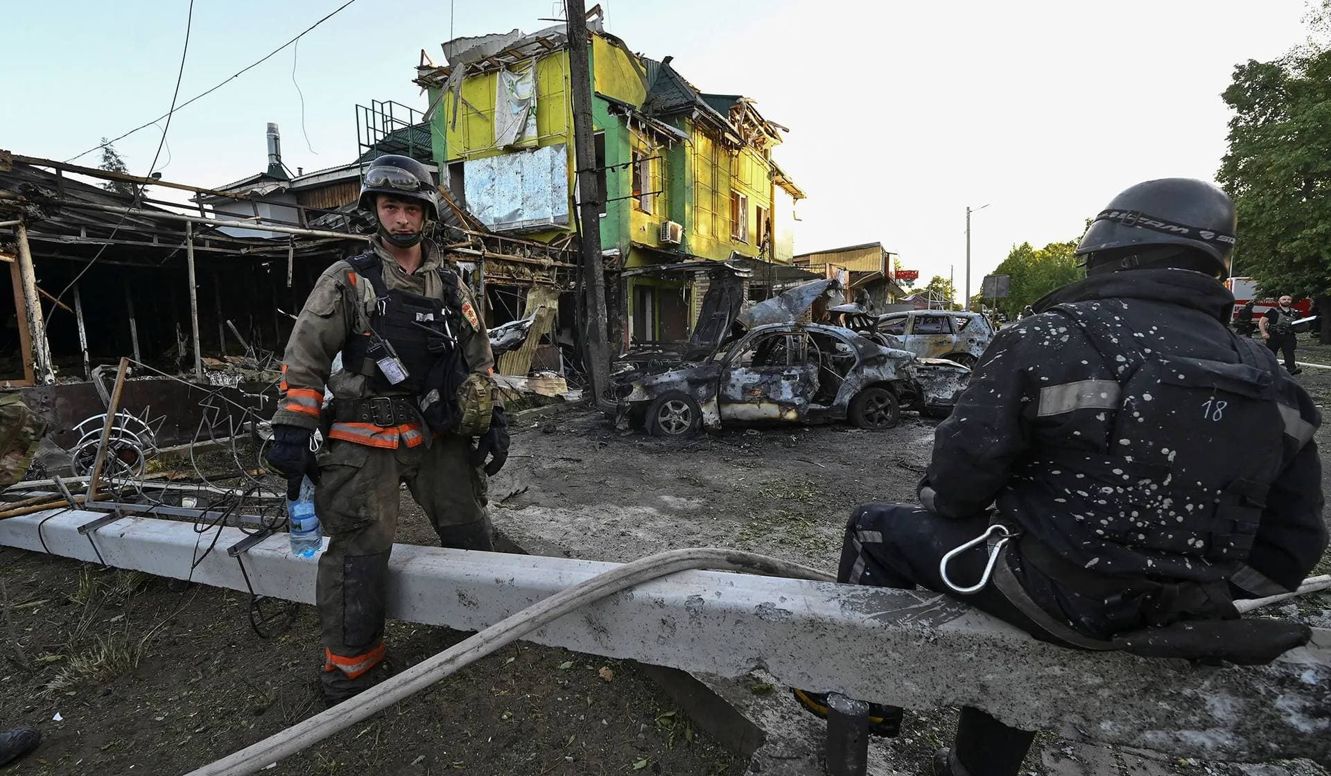 Firefighters work at a site of a Russian missile strike in the town of Vilniansk, Zaporizhzhia Region