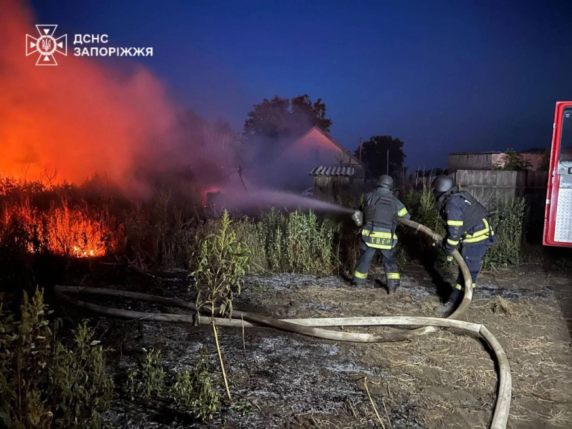 Firefighters battle a fire in the aftermath of a Russian military strike in a location given as Zaporizhzhia Region