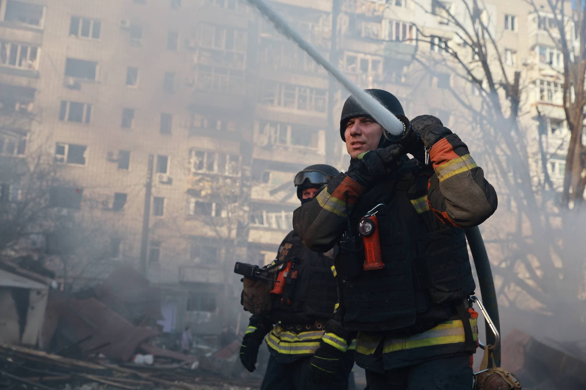 Firefighters put out the fire at a residential neighborhood damaged by Russian aerial guided bomb in Zaporizhzhia