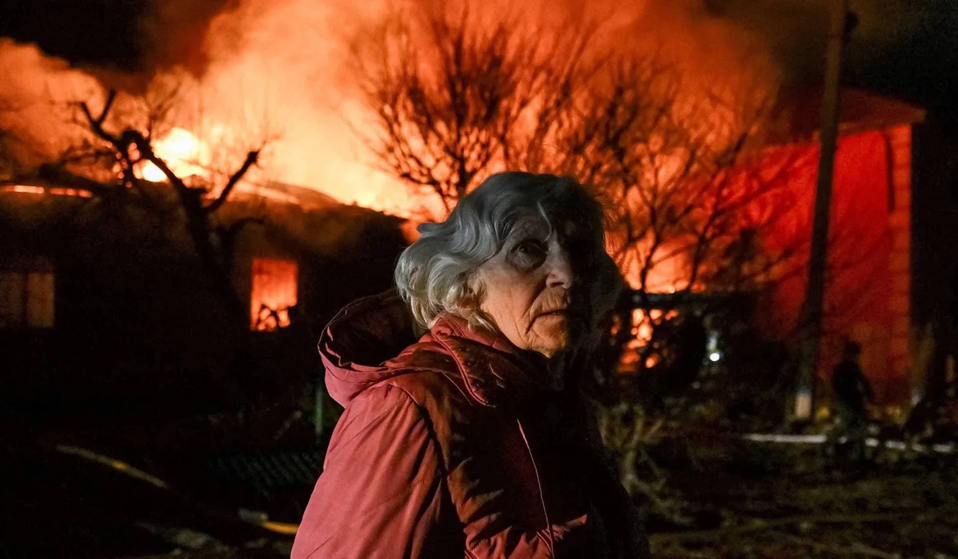 A resident stands at the site of buildings hit by a Russian drone strike in Zaporizhzhia