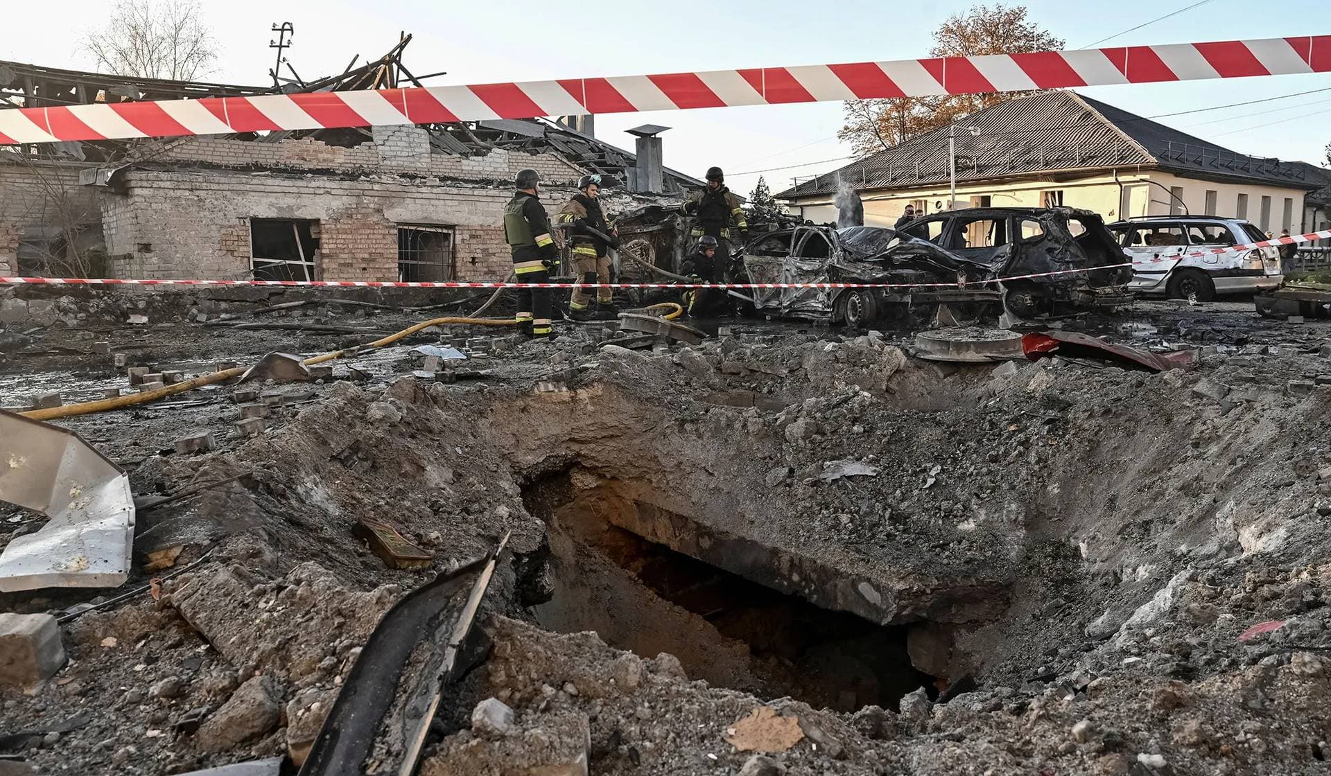 Rescuers work at a site of an apartment building hit by a Russian air strike in Zaporizhzhia